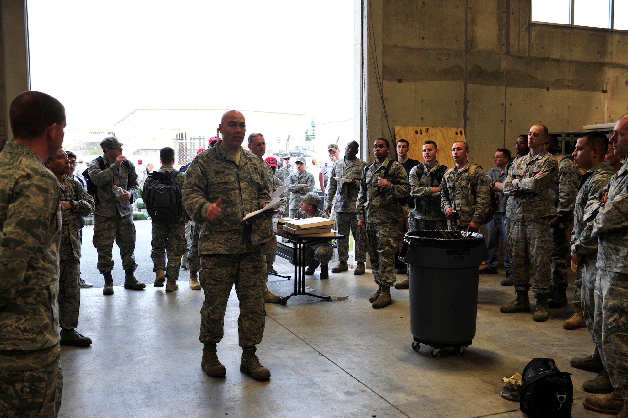 Lt. Col. James Greene, 18th Civil Engineer Squadron commander, addresses his Airmen before they deployed to Misawa Air Base, in northern Japan March 12. More than 50 members of the 18th CES deployed to Misawa to help restore power and basic services there following a series of earthquakes and tsunami. (U.S. Air Force photo / Staff Sgt. Lakisha Croley)