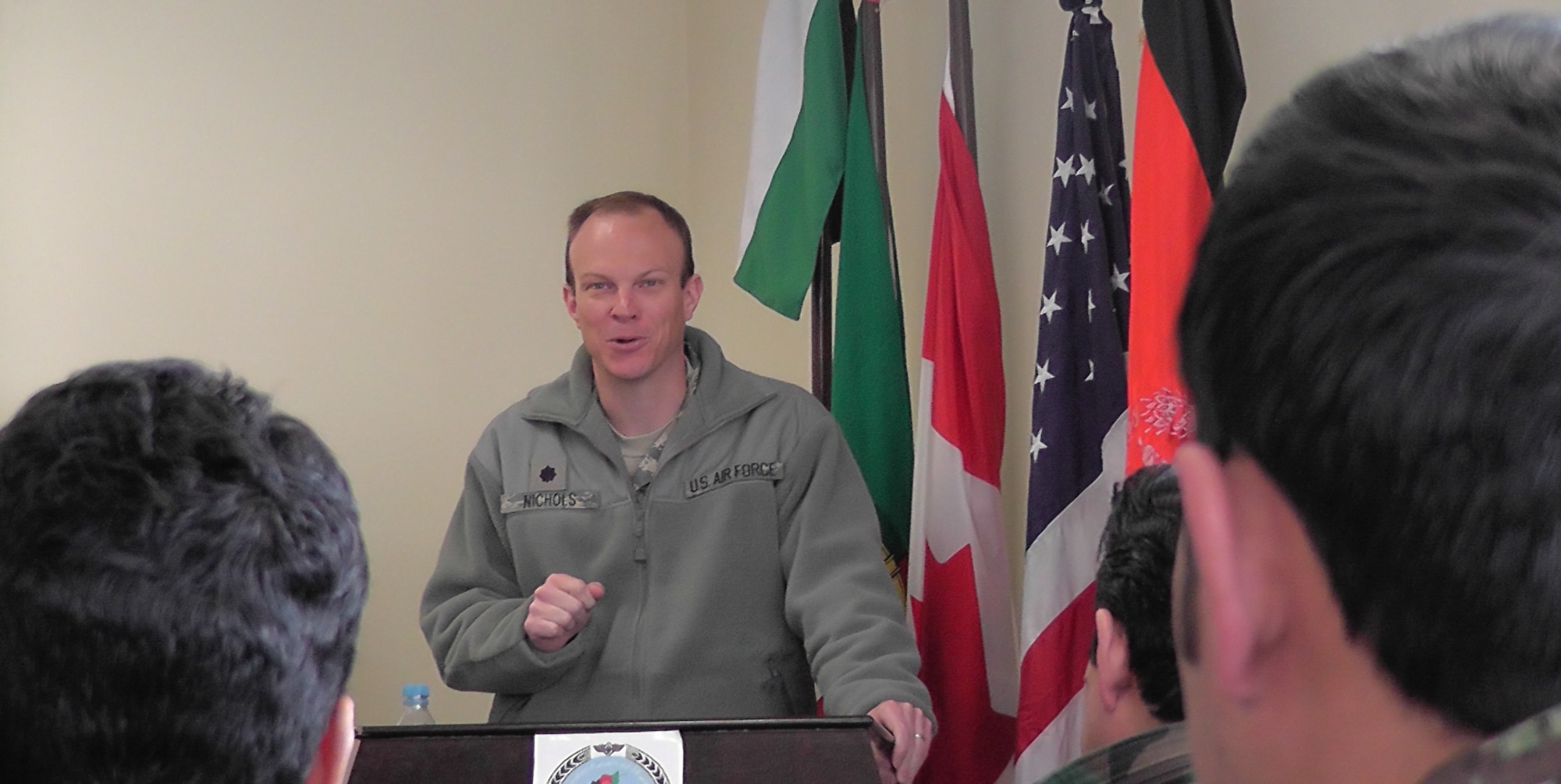 KABUL, Afghanistan - Lt. Col. Ryan Nichols, Commander of the 738th Air Expeditionary Advisory Squadron, speaks to the fifteen members of the Afghan Air Force who graduated from the pre-undergraduate flight indoctrination at Pohantoon-e-Hawayee, the Afghan Air Force's "Big Air School", on the Afghan Air Force base in Kabul, Afghanistan Mar. 10. (U.S. Air Force photo by Capt. Rob Leese)