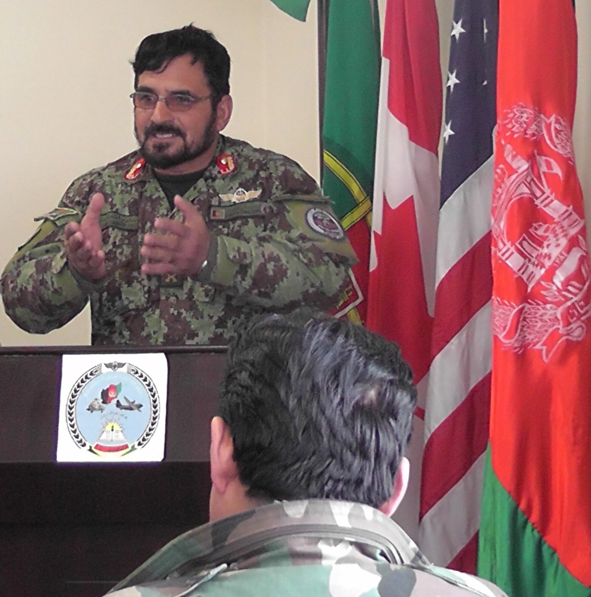 KABUL, Afghanistan - Lt. Col. Sheenwarai Matiuallah, the Chief of Staff at PeH, speaks to the fifteen members of the Afghan Air Force who graduated from the pre-undergraduate flight indoctrination at Pohantoon-e-Hawayee, the Afghan Air Force's "Big Air School", on the Afghan Air Force base in Kabul, Afghanistan Mar. 10. (U.S. Air Force photo by Capt. Rob Leese)