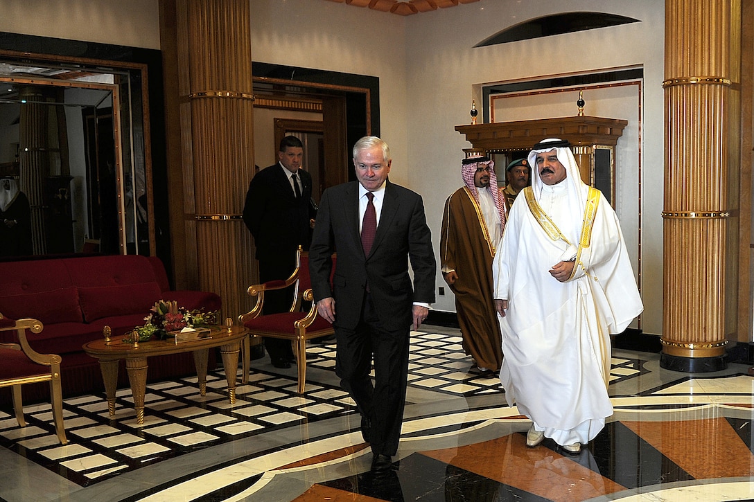 U.S. Defense Secretary Robert M. Gates walks with Bahrain's King Hamad bin Isa al-Khalifa after their discussions at Safriyah Palace in Bahrain, March 12, 2011.