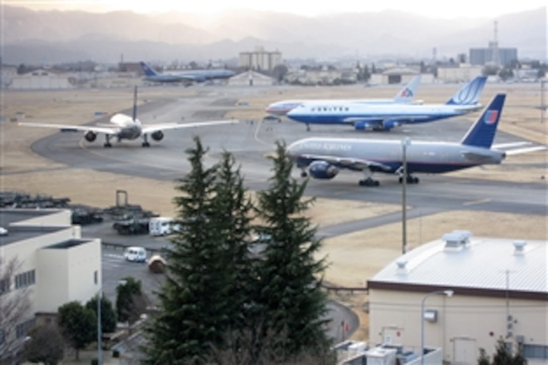 Several commercial aircraft are shown at Yokota Air Base, Japan, March 11, 2011, after diverting from Narita International Airport near Tokyo. Narita closed after a magnitude 8.9 earthquake struck mainland Japan in midafternoon. 