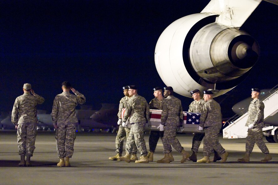 A U.S. Army carry team transfers the remains of Army Pfc. Andrew M. Harper, of Maidsville, W.Va., at Dover Air Force Base, Del., March 13, 2011. Harper was assigned to the 3rd Squadron, 2nd Stryker Cavalry Regiment, Vilseck, Germany. (U.S. Air Force photo/Roland Balik)
