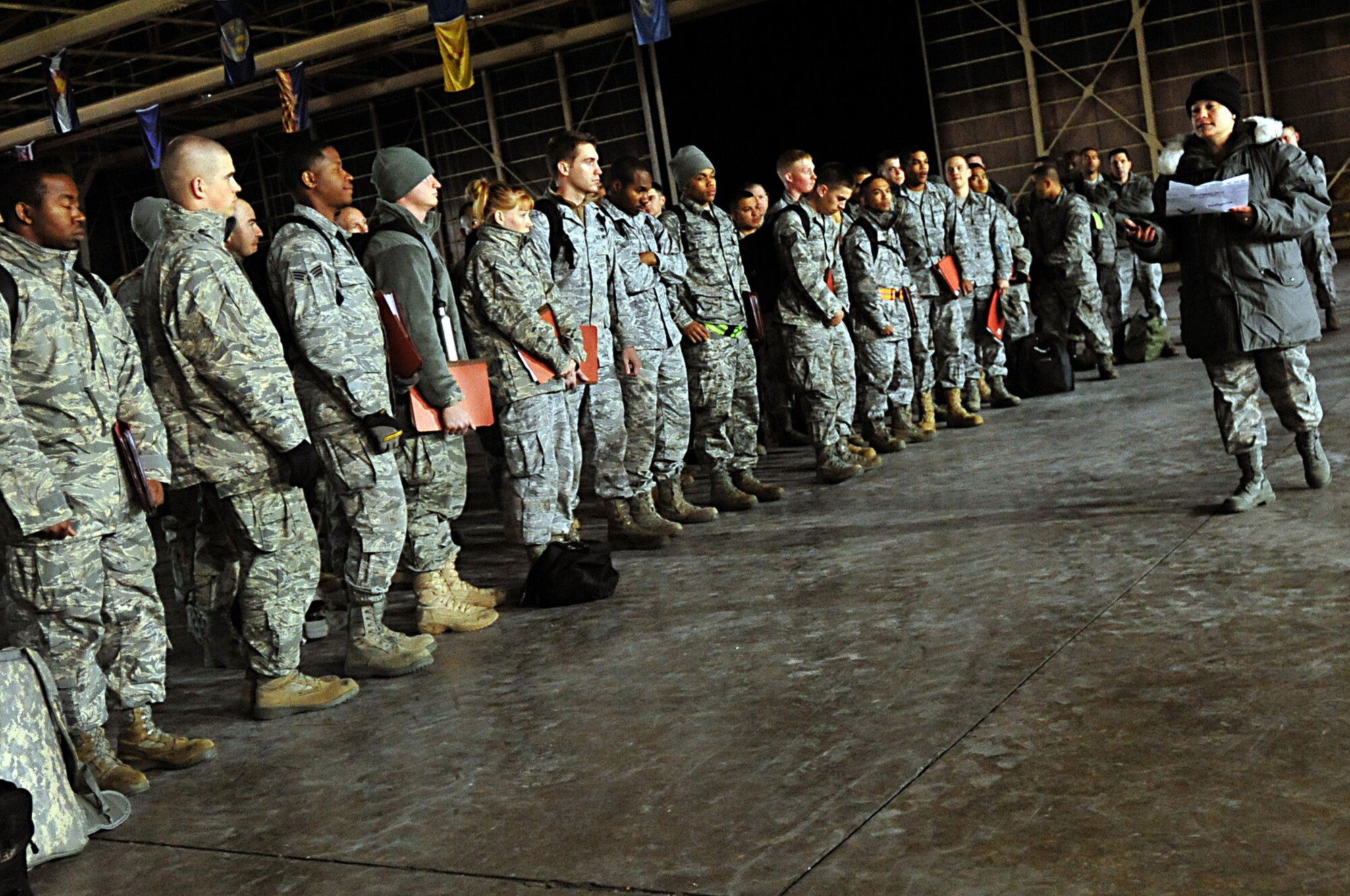 MISAWA AIR BASE, Japan -- U.S. Air Force Master Sgt. Grisell Chong gives a briefing to military members after their arrival Mar. 13. More than 50 civil engineer members from Kadena Air Force Base, Japan arrived here to help out with base recovery operations. Sergeant Chong is assigned to the 35th Force Support Squadron. (U.S. Air Force photo by Staff Sgt. Marie Brown\Released)
