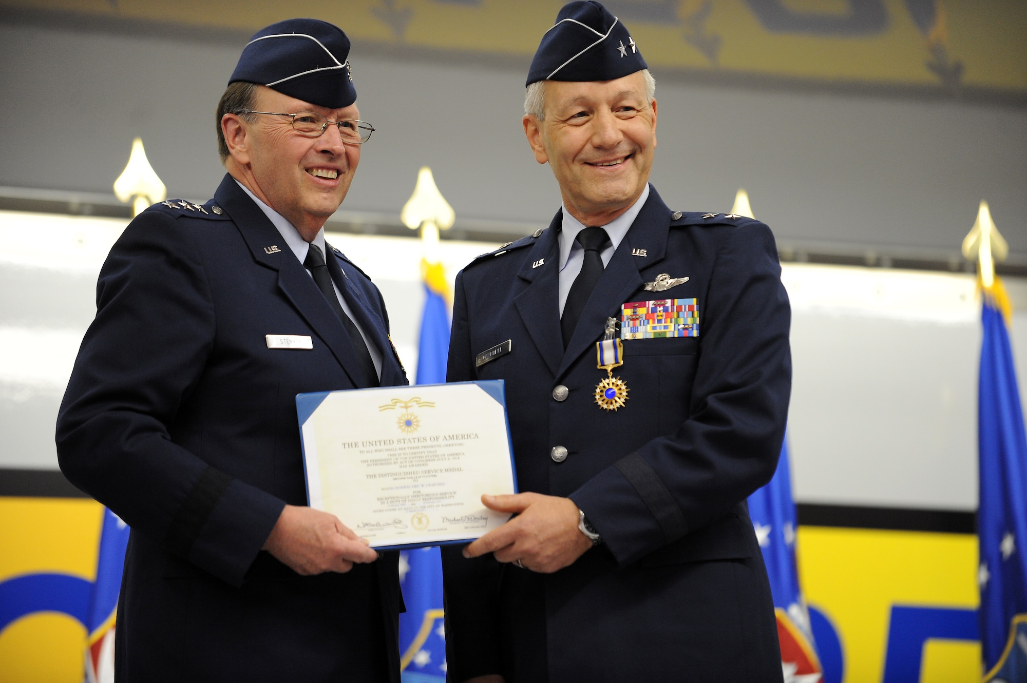 U.S. Air Force Lieutenant General Charles E. Stenner Jr., Chief of Air Force Reserve, Headquarters U.S. Air Force, Washington, D.C. and Commander, Air Force Reserve Command, Robins Air Force Base, Ga., presents Major General Eric W. Crabtree with the Distinguished Service Medal during a change of command ceremony at March Air Reserve Base, Calif., March 12, 2011.  (U.S. Air Force photo by Technical Sgt. Christine Jones) (released)