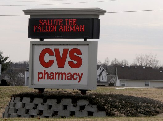 A sign on a local business near Scott Air Force Base, Ill. honors Airman 1st Class Zachary Cuddeback who was killed, along with another Airman, when a man opened fire on a bus of U.S. Airmen at an airport in Frankfurt, Germany March 2, 2011. Airman Cuddeback will be laid to rest next to his grandfather at a cemetery in O'Fallon, Ill. (U.S. Air Force photo/Staff Sgt. Brian J. Valencia)