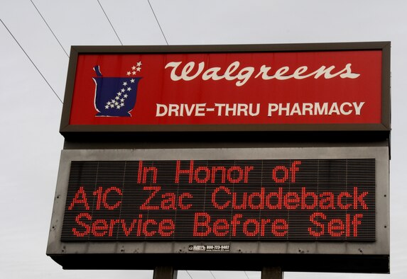 A sign on a local business near Scott Air Force Base, Ill. honors Airman 1st Class Zachary Cuddeback who was killed, along with another Airman, when a man opened fire on a bus of U.S. Airmen at an airport in Frankfurt, Germany March 2, 2011. Airman Cuddeback will be laid to rest next to his grandfather at a cemetery in O'Fallon, Ill. (U.S. Air Force photo/Staff Sgt. Brian J. Valencia)