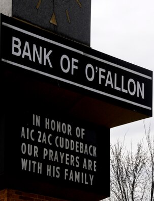 A sign on a local business near Scott Air Force Base, Ill. honors Airman 1st Class Zachary Cuddeback who was killed, along with another Airman, when a man opened fire on a bus of U.S. Airmen at an airport in Frankfurt, Germany March 2, 2011. Airman Cuddeback will be laid to rest next to his grandfather at a cemetery in O'Fallon, Ill. (U.S. Air Force photo/Staff Sgt. Brian J. Valencia)