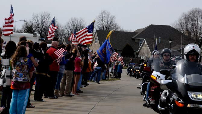 Freedom Riders lead the procession route of Airman 1st Class Zachary Cuddeback March 12, 2011 in O’Fallon, Ill. Airman Cuddeback and another Airman were killed March 2, 2011 when a man opened fire on a bus of U.S. Airmen at an airport in Frankfurt, Germany. Airman Cuddeback will be laid to rest next to his grandfather at a cemetery in O'Fallon, Ill. (U.S. Air Force photo/Staff Sgt. Brian J. Valencia)