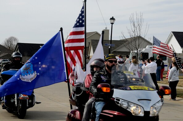 Freedom Riders lead the procession route of Airman 1st Class Zachary Cuddeback March 12, 2011 in O’Fallon, Ill. Airman Cuddeback and another Airman were killed March 2, 2011 when a man opened fire on a bus of U.S. Airmen at an airport in Frankfurt, Germany. Airman Cuddeback will be laid to rest next to his grandfather at a cemetery in O'Fallon, Ill. (U.S. Air Force photo/Staff Sgt. Brian J. Valencia)