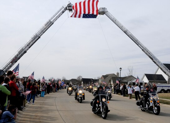 Freedom Riders lead the procession route of Airman 1st Class Zachary Cuddeback March 12, 2011 in O’Fallon, Ill. Airman Cuddeback and another Airman were killed March 2, 2011 when a man opened fire on a bus of U.S. Airmen at an airport in Frankfurt, Germany. Airman Cuddeback will be laid to rest next to his grandfather at a cemetery in O'Fallon, Ill. (U.S. Air Force photo/Staff Sgt. Brian J. Valencia)