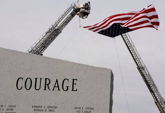 “COURAGE” reads on the O'Fallon Veterans' Monument along the procession route of Airman 1st Class Zachary Cuddeback March 12, 2011 in O’Fallon, Ill. Airman Cuddeback and another Airman were killed March 2, 2011 when a man opened fire on a bus of U.S. Airmen at an airport in Frankfurt, Germany. Airman Cuddeback will be laid to rest next to his grandfather at a cemetery in O'Fallon, Ill. (U.S. Air Force photo/Staff Sgt. Brian J. Valencia)