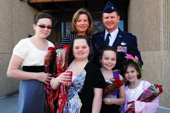 Col. Louis Patriquin, 403rd Operations Group commander, poses with his wife, Jerrilynn and their four daughters after his promotion ceremony. The girls were holding the roses their father gave them during the ceremony. Family and friends gathered to celebrate at the Bay Breeze Event Center.   (U.S. Air Force photo by Senior Airman Tabitha Dupas)


