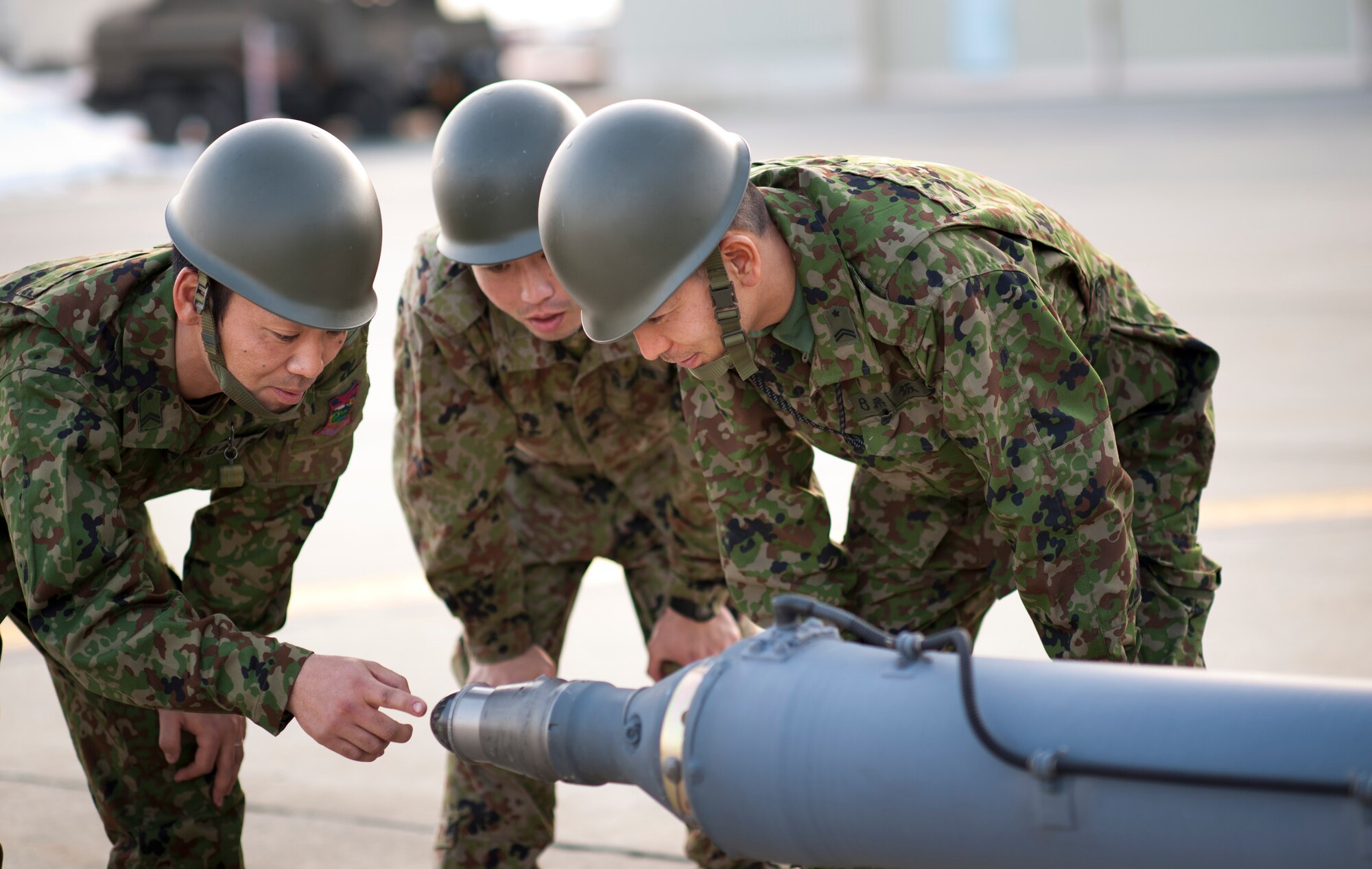 YAMAGATA, Japan -- Members of Japan Ground Self-Defense Force and a joint team of U.S. Air Force and Marine personnel discuss the possibility of using Yamagata as a fuel staging area here March 13. The area would be used to refuel aircraft assisting with Japan's earthquake and tsunami recovery efforts. (U.S. Air Force photo/Staff Sgt. Samuel Morse)