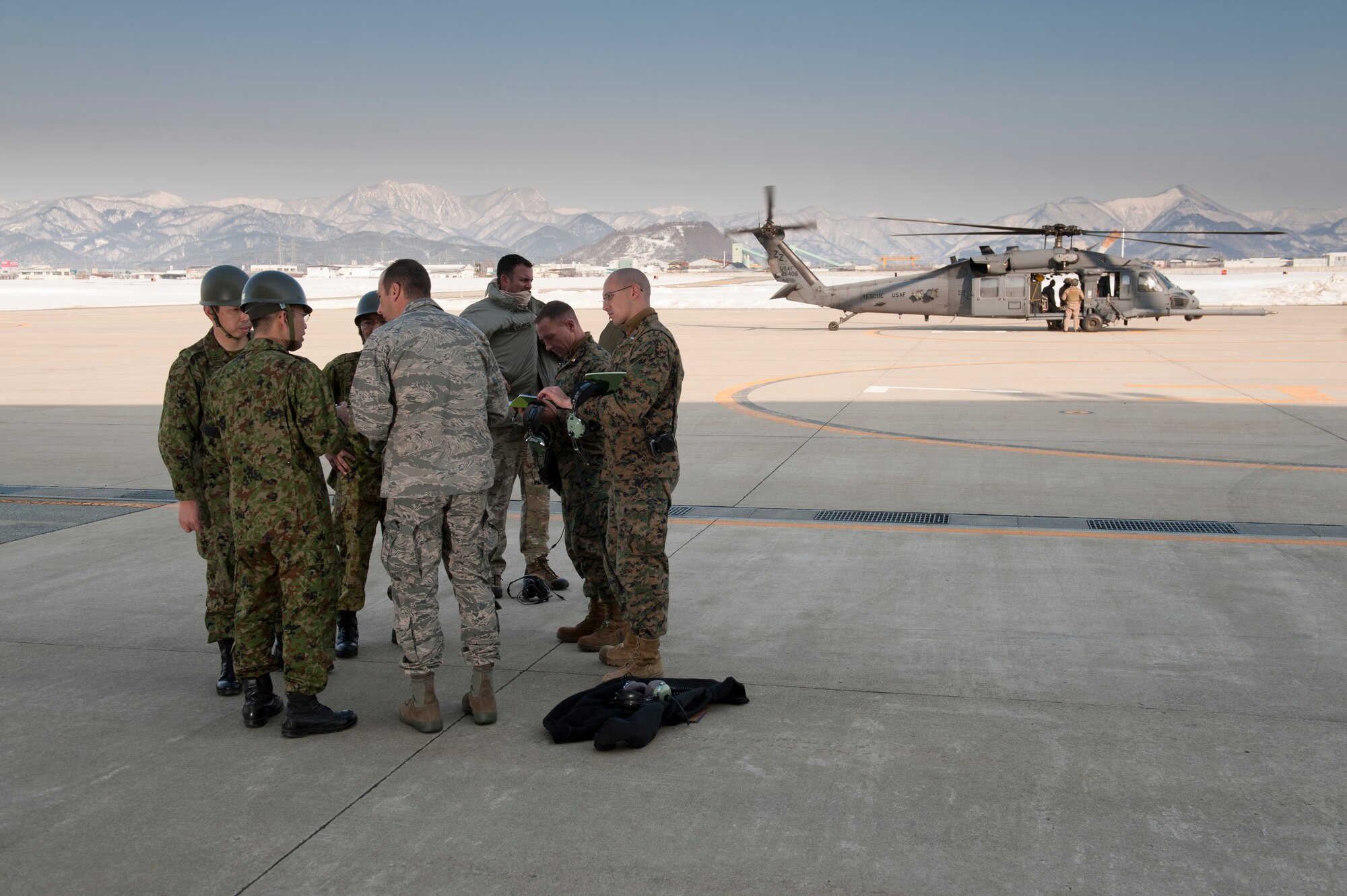YAMAGATA, Japan --Members of the Japan Ground Self-Defense Force and a joint team of U.S. Airmen and Marines discuss the possibility of using Yamagata as a fuel staging area here March 13. The fueling area would be used to refuel aircraft assisting with Japan's earthquake and tsunami recovery.    (U.S. Air Force photo/Staff Sgt. Samuel Morse) 