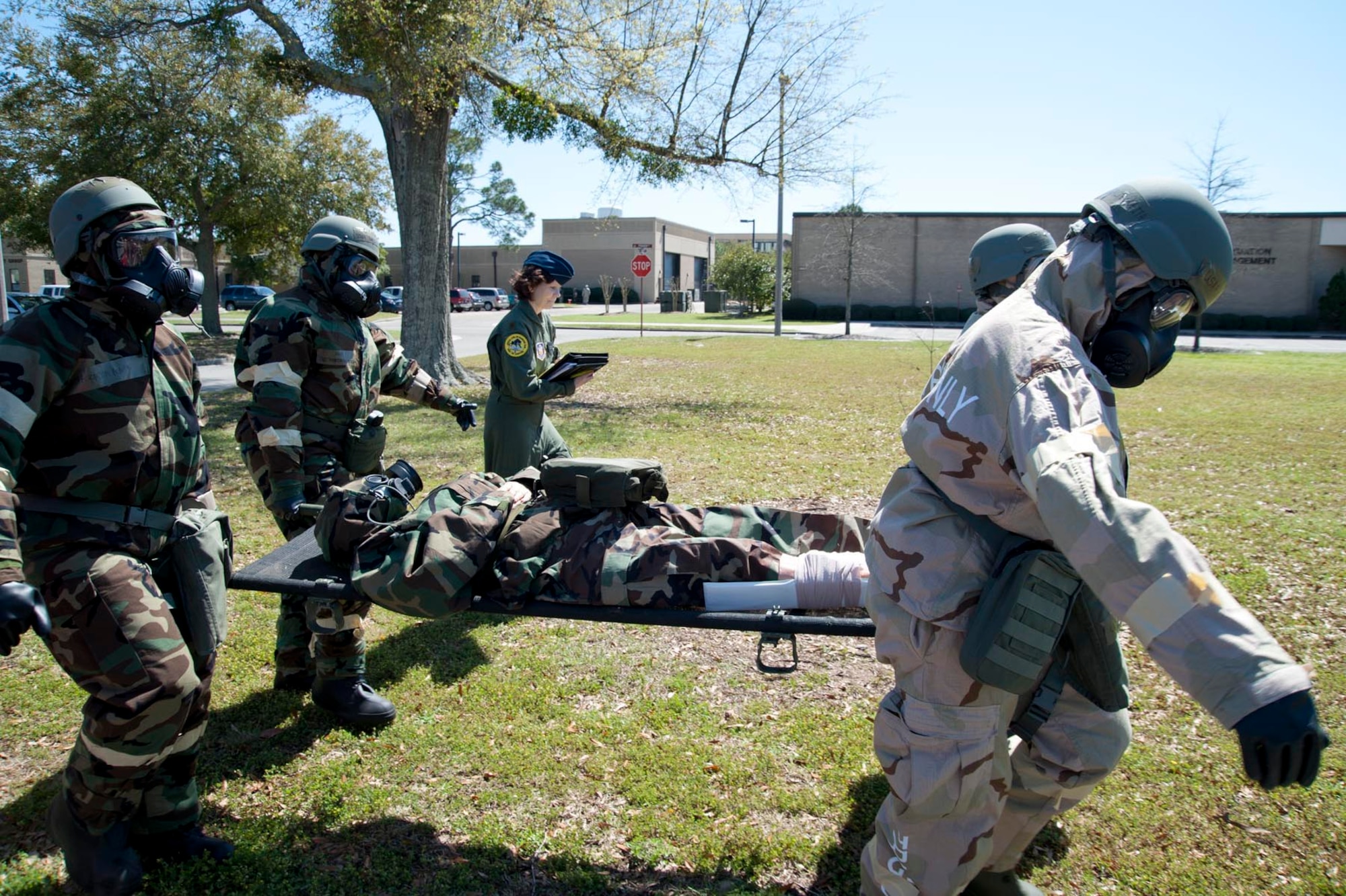 After administering Self Aid and Buddy Care, members of the 345th Airlift Squadron and the 403rd Aeromedical Staging Squadron transport a “wounded” Airman to a secure area after a simulated chemical attack. During the March unit training assembly, Citizen Airmen of the 403rd Wing participated in a Readiness Assistance Visit to prepare for the wing’s upcoming Operational Readiness Inspection. (U.S. Air Force photo by Tech. Sgt. Ryan Labadens)