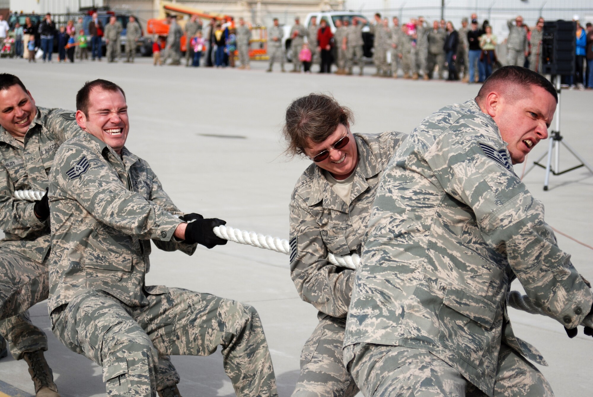Members of the Utah Air National Guard's maintenance squadron strain to pull a KC-135 Stratotanker during Winter Wingman Day 2011 at the Utah Air National Guard base on March 12. Three teams, of 15 people each, compete against the clock to see which team can rope-pull a 120,000 pound Stratotanker, a distance of 40 feet, the fastest. (U.S. Air Force photo by Senior Master Sgt. Sterling Poulson)(RELEASED)