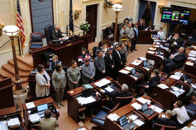 Current and former military members serving from World War II to present day stand in front of the Utah State Senate floor during Latino Appreciation Day Feb. 16, 2011, at the Utah State Capitol in Salt Lake City. The Utah National Guard’s highest ranking Hispanic members Lt. Col Frances Marcus, and Chief Warrant Officer 5 Fabian Salazar, Utah National Guard, and Maj. Krista DeAngelis and Chief Master Sgt. Corey Quintana, Utah Air National Guard, were recognized during the ceremony. (U.S. Air Force photo by Tech. Sgt. Kelly Collett)(RELEASED)