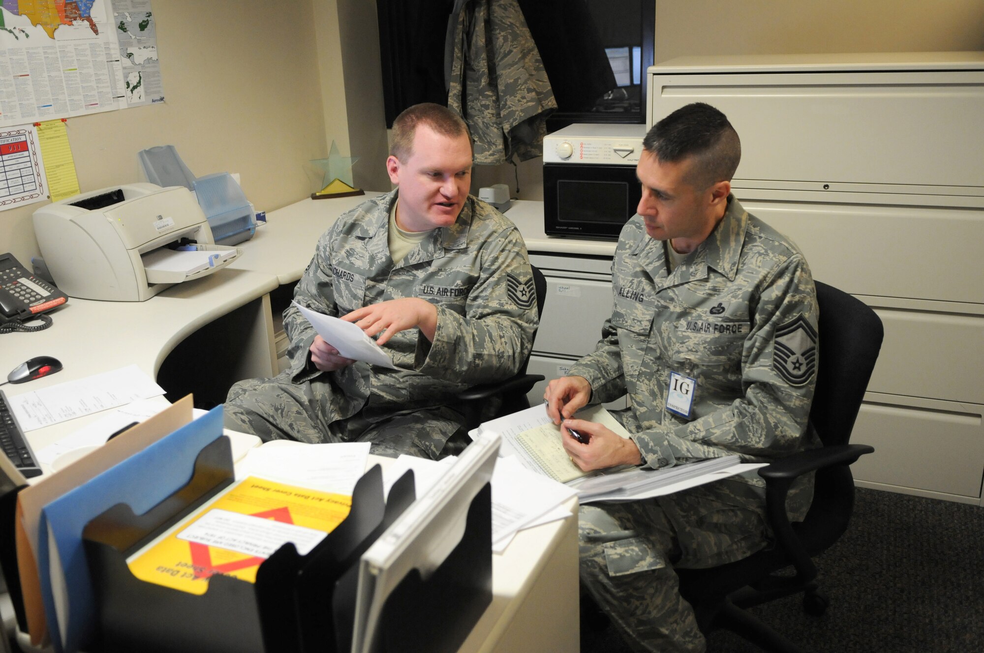 Tech. Sgt. Jared Richards of the 151st Air Refueling Wing?s Training and Education Office explains his programs to Senior Master Sgt. James Alling of the Inspector General Team during the wing's Compliance Inspection on Feb. 26, 2011, at the Utah Air National Guard Base in Salt Lake City.(U.S. Air Force photo by Master Sergeant Gary J. Rihn)(RELEASED)