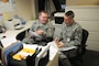 Tech. Sgt. Jared Richards of the 151st Air Refueling Wing?s Training and Education Office explains his programs to Senior Master Sgt. James Alling of the Inspector General Team during the wing's Compliance Inspection on Feb. 26, 2011, at the Utah Air National Guard Base in Salt Lake City.(U.S. Air Force photo by Master Sergeant Gary J. Rihn)(RELEASED)