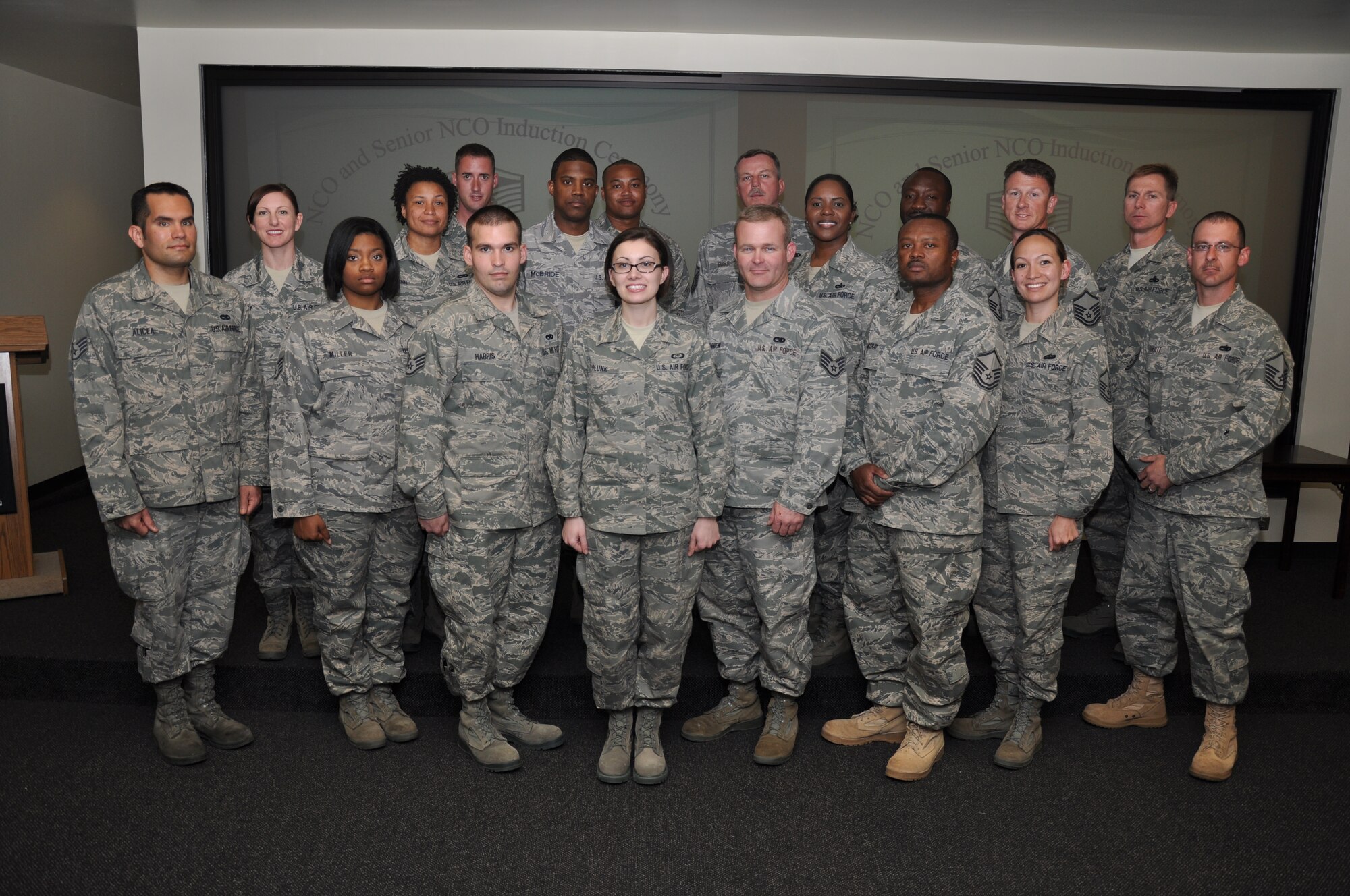 Col Steven Chapman and Command Chief Master Sergeant Gigi Manning congratulated the 315th Airlift Wing's newest NCOs and Senior NCOs during a ceremony here March 12. The induction ceremony recognized 18 airmen as they reached a personal and professional milestone. (U.S. Air Force Photo/SSgt Shane Ellis)