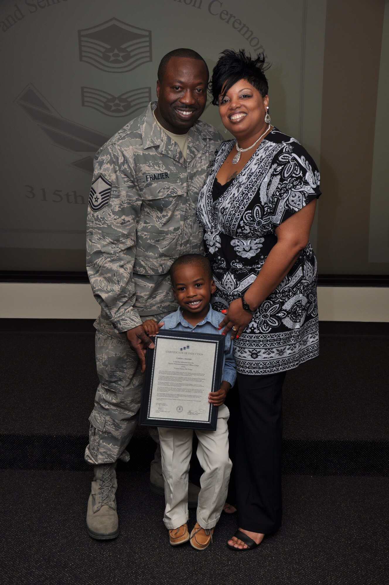 Col Steven Chapman and Command Chief Master Sergeant Gigi Manning congratulated the 315th Airlift Wing's newest NCOs and Senior NCOs during a ceremony here March 12. The induction ceremony recognized 18 airmen as they reached a personal and professional milestone.(U.S. AirForce photo/SSgt Shane Ellis)
