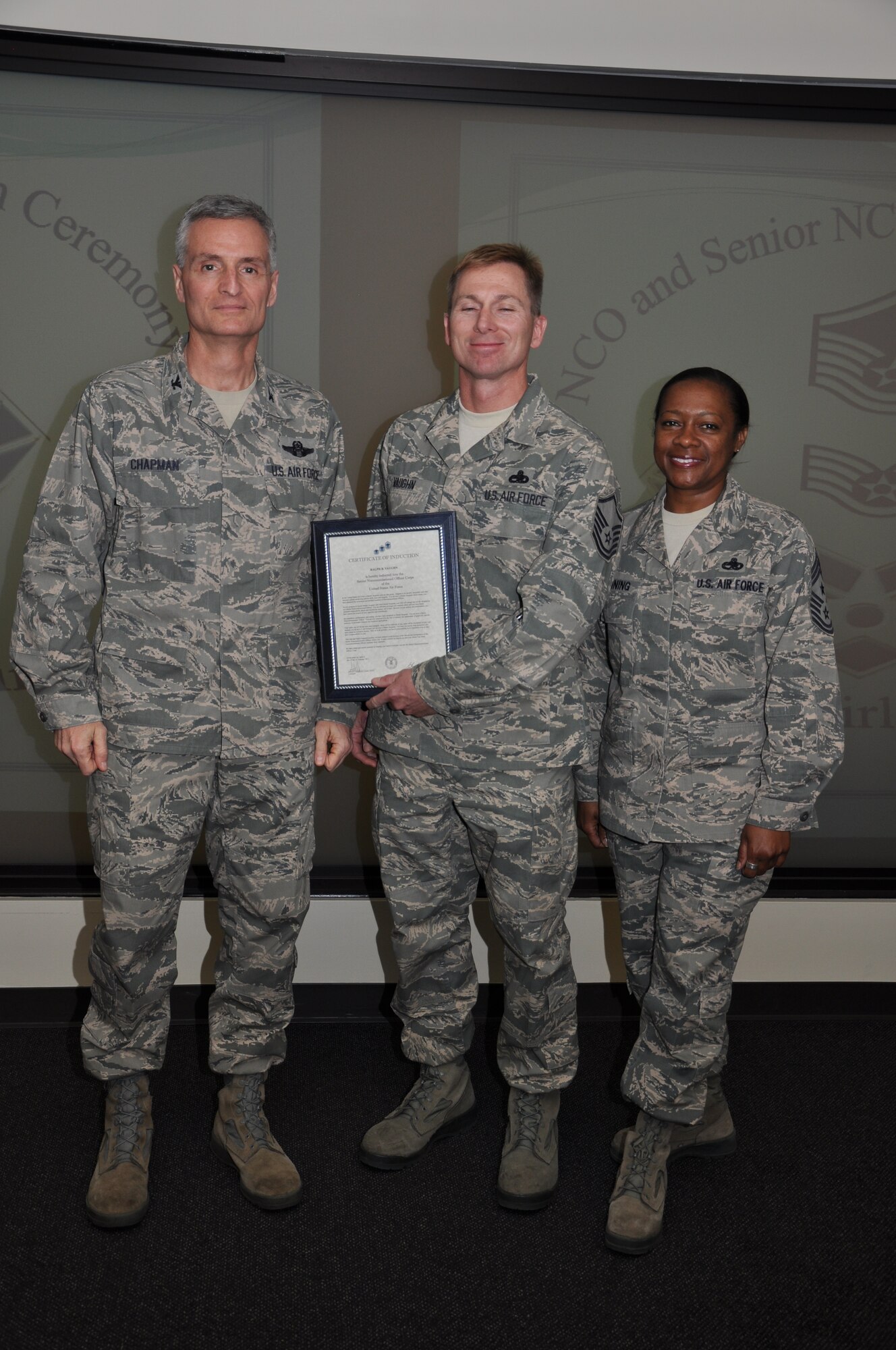 Col Steven Chapman and Command Chief Master Sergeant Gigi Manning congratulated the 315th Airlift Wing's newest NCOs and Senior NCOs during a ceremony here March 12. The induction ceremony recognized 18 airmen as they reached a personal and professional milestone.(U.S. AirForce photo/SSgt Shane Ellis)