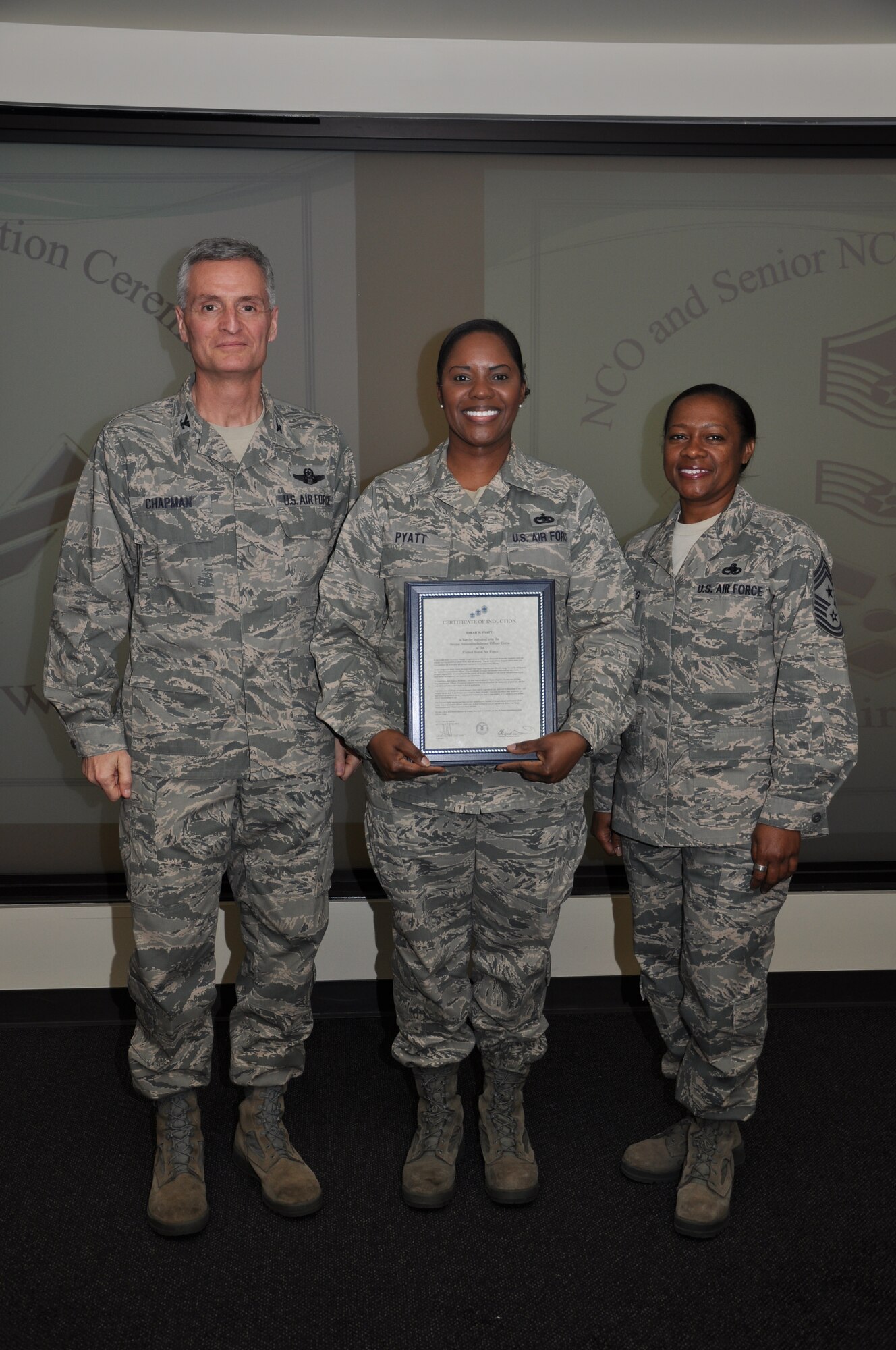 Col Steven Chapman and Command Chief Master Sergeant Gigi Manning congratulated the 315th Airlift Wing's newest NCOs and Senior NCOs during a ceremony here March 12. The induction ceremony recognized 18 airmen as they reached a personal and professional milestone.(U.S. AirForce photo/SSgt Shane Ellis)