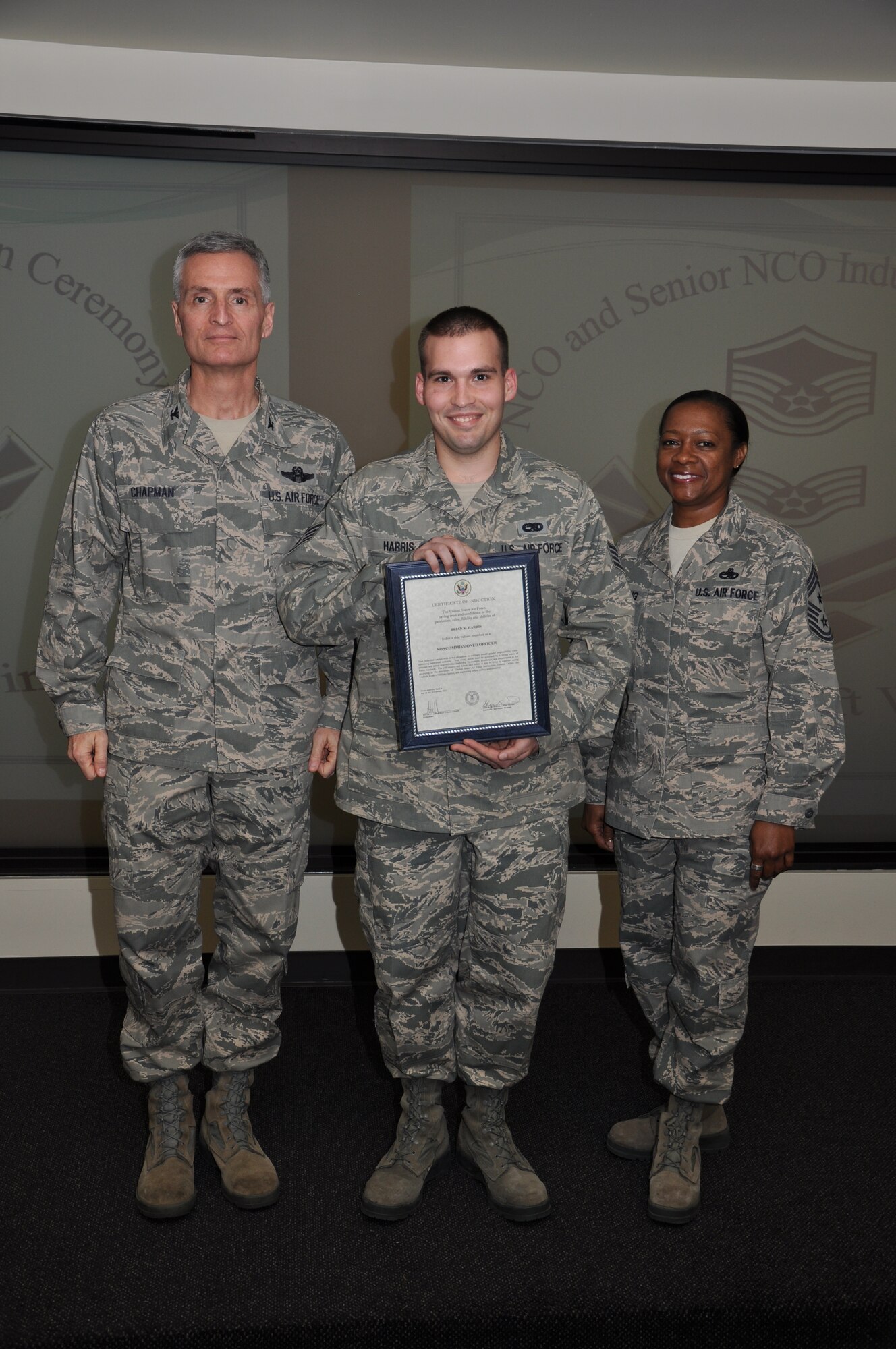 Col Steven Chapman and Command Chief Master Sergeant Gigi Manning congratulated the 315th Airlift Wing's newest NCOs and Senior NCOs during a ceremony here March 12. The induction ceremony recognized 18 airmen as they reached a personal and professional milestone.(U.S. AirForce photo/SSgt Shane Ellis)
