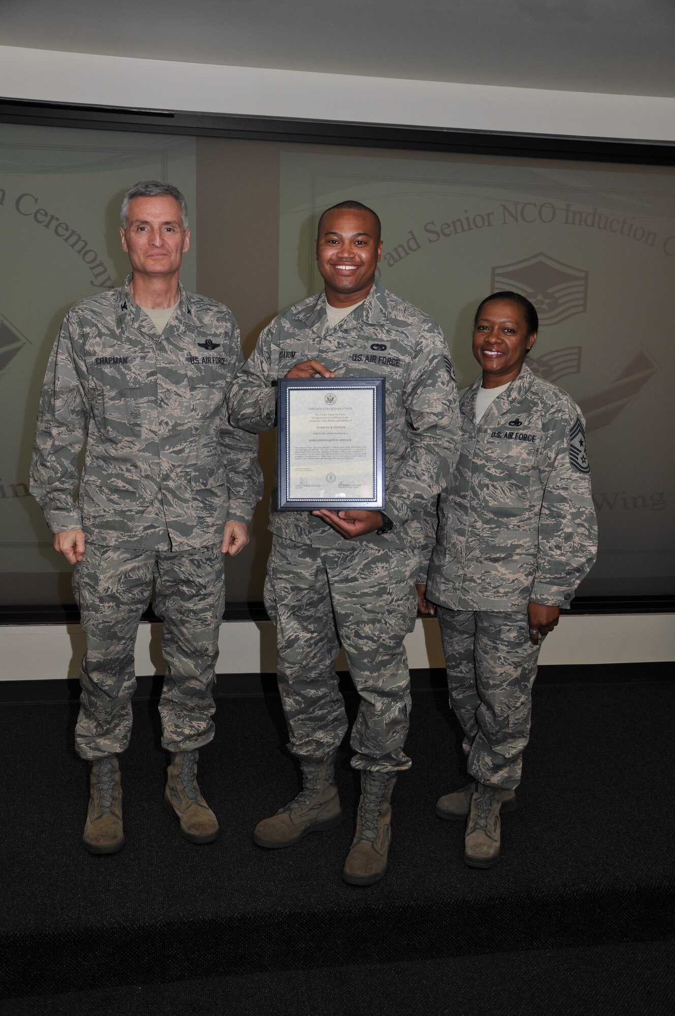 Col Steven Chapman and Command Chief Master Sergeant Gigi Manning congratulated the 315th Airlift Wing's newest NCOs and Senior NCOs during a ceremony here March 12. The induction ceremony recognized 18 airmen as they reached a personal and professional milestone.