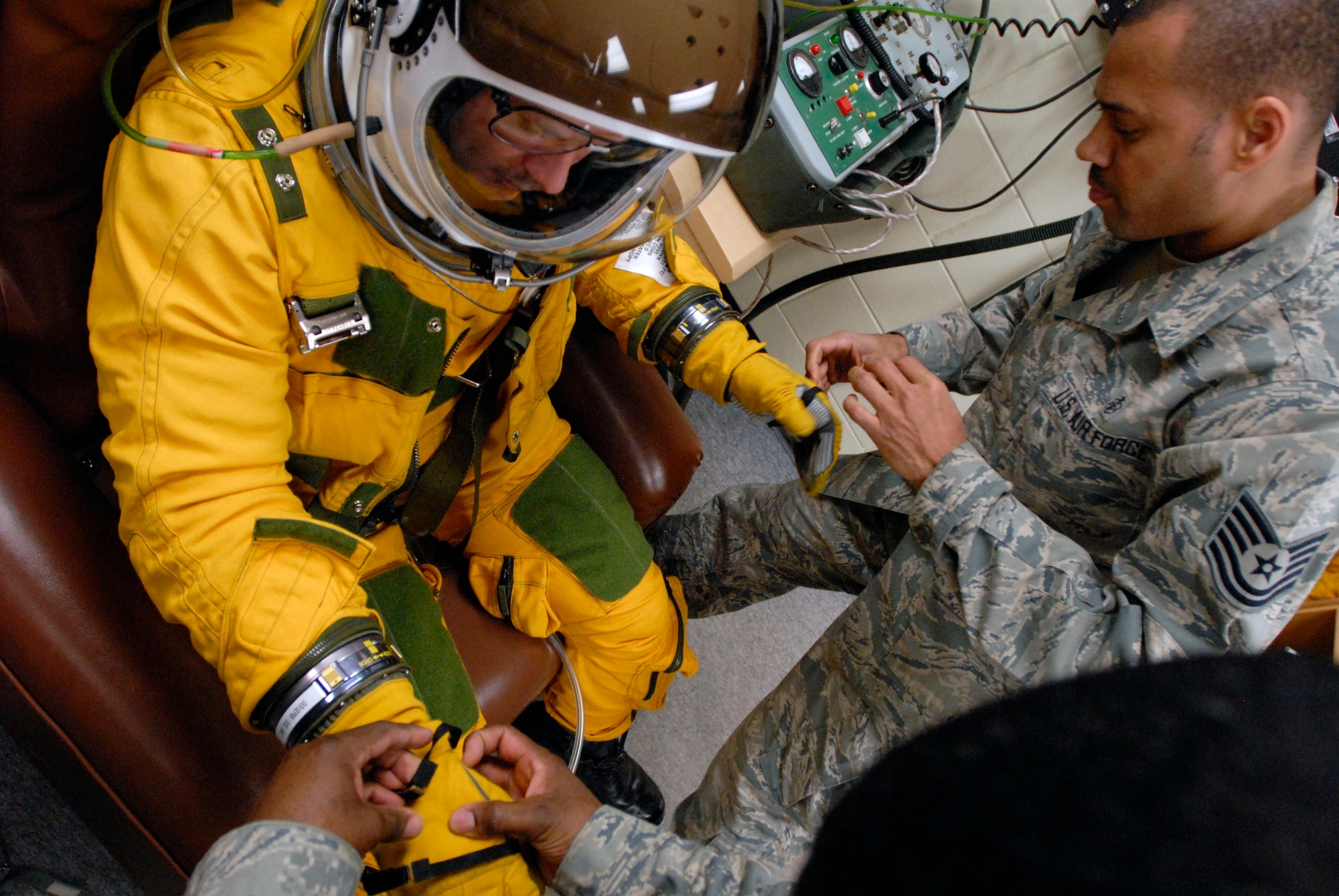 Tech. Sgt. Vontez Morrow, a physiology technician assigned to the 5th Reconnaissance Squadron, preps U-2 pilot Capt. Beau Block, also of the 5th Reconnaissance Squadron, for a humanitarian mission departing from Osan Air Base, Republic of Korea, March 13. The mission was flown to capture imagery of the earthquake- and tsunami-affected areas of Japan. (U.S. Air Force photo by Senior Master Sgt. Paul Holcomb)