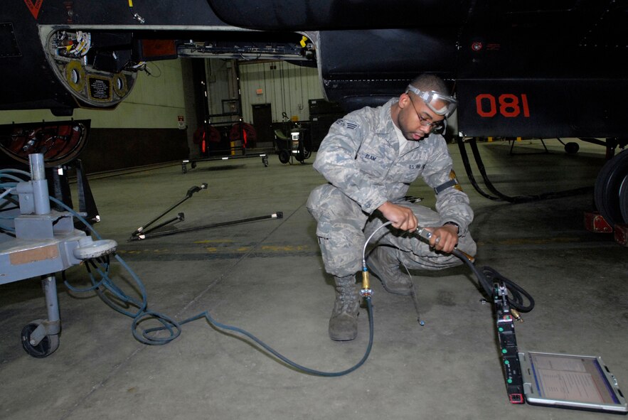 Senior Airman Joshua Elam, a crew chief assigned to the 5th Reconnaissance Squadron, prepares for tire pressure servicing on a U-2 aircraft March 13 at Osan Air Base, Republic of Korea. The U-2 was being prepared for a humanitarian mission to capture imagery of the earthquake- and tsunami-affected areas of Japan. (U.S. Air Force photo by Senior Master Sgt. Paul Holcomb)