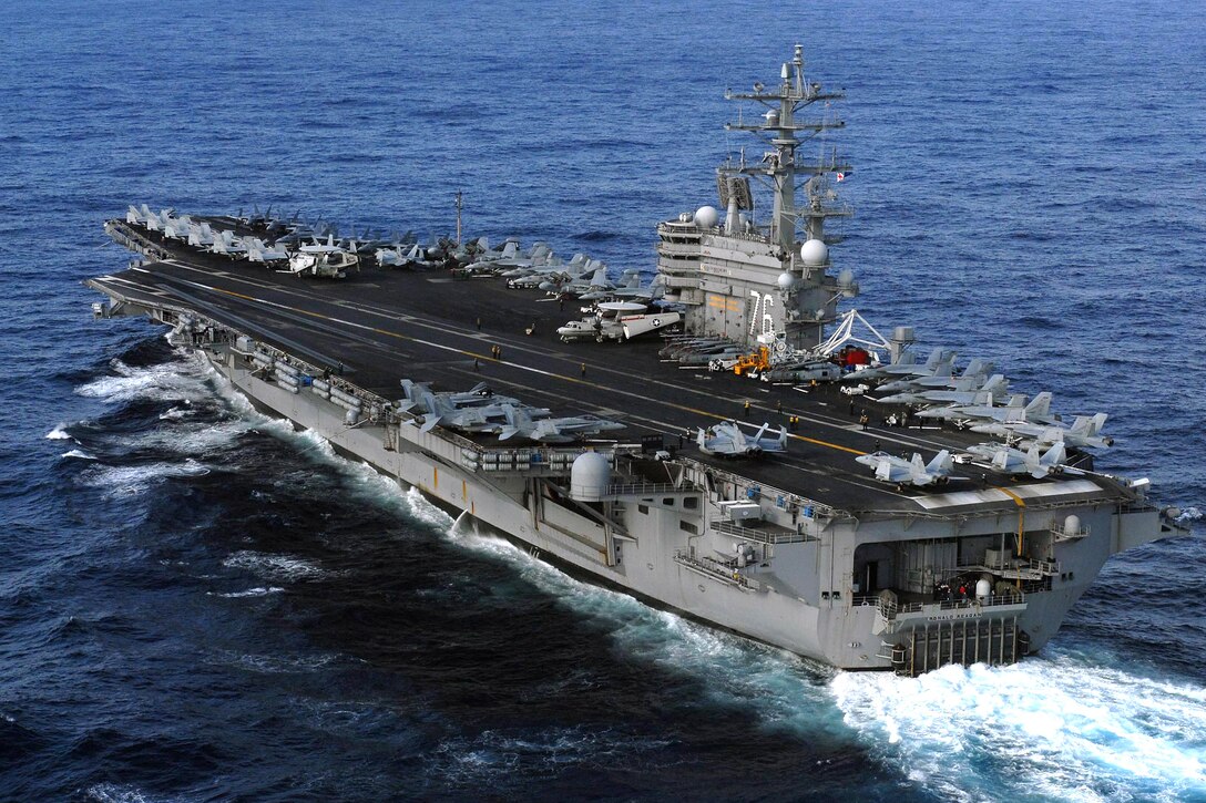 The USS Ronald Reagan is underway in the 7th Fleet area of ...