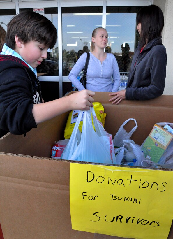 Residents of Naval Air Facility Atsugi collect food, water, and relief supplies to support earthquake and tsunami relief operations in Japan, March 11, 2011.