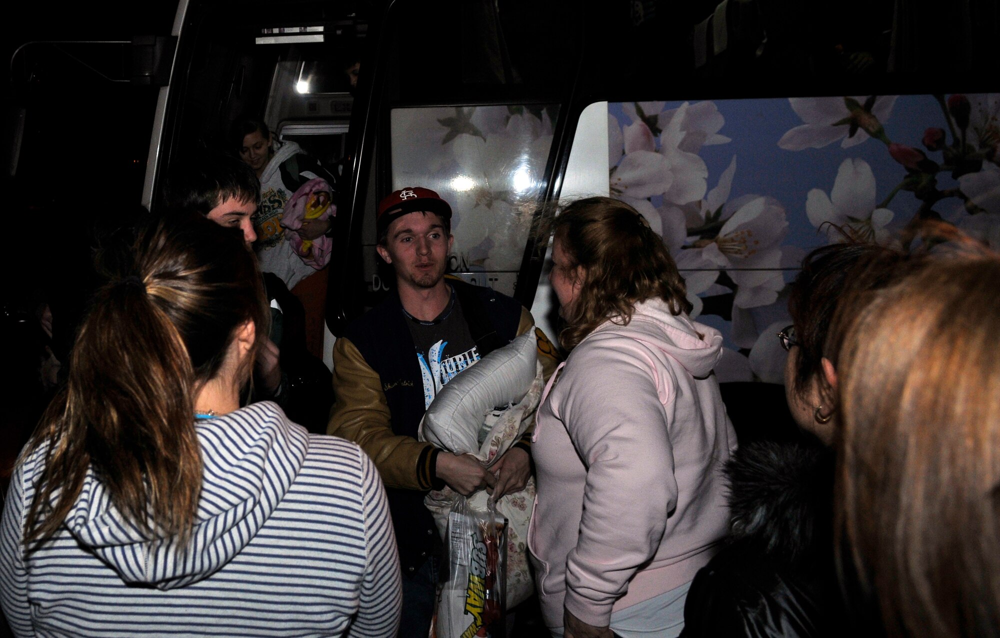 MISAWA AIR BASE, Japan -- The last of the Edgren High School sports teams arrive back home from Yokota Air Base, Japan Mar. 14. The teams were separated from their families for three days after the earthquake cancelled their scheduled games and subsequently their travel plans. (U.S. Air Force photo by Tech. Sgt. Phillip Butterfield\Released)