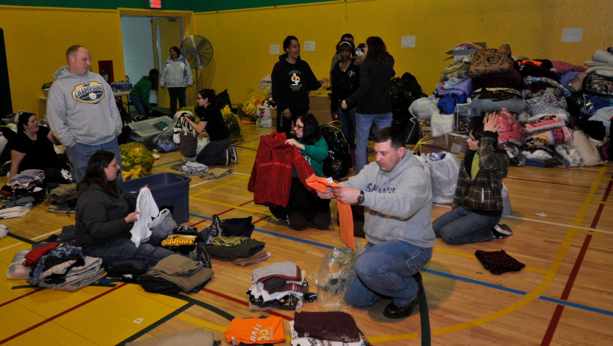 MISAWA AIR BASE, Japan -- Residents deliver and sort clothing donations at Edgren High School for the Misawa City community Mar. 14. Misawa has donated pants, shirts, shoes and jackets that will be boxed and delivered to off-base community centers. (U.S. Air Force photo by Tech. Sgt. Phillip Butterfield\Released)