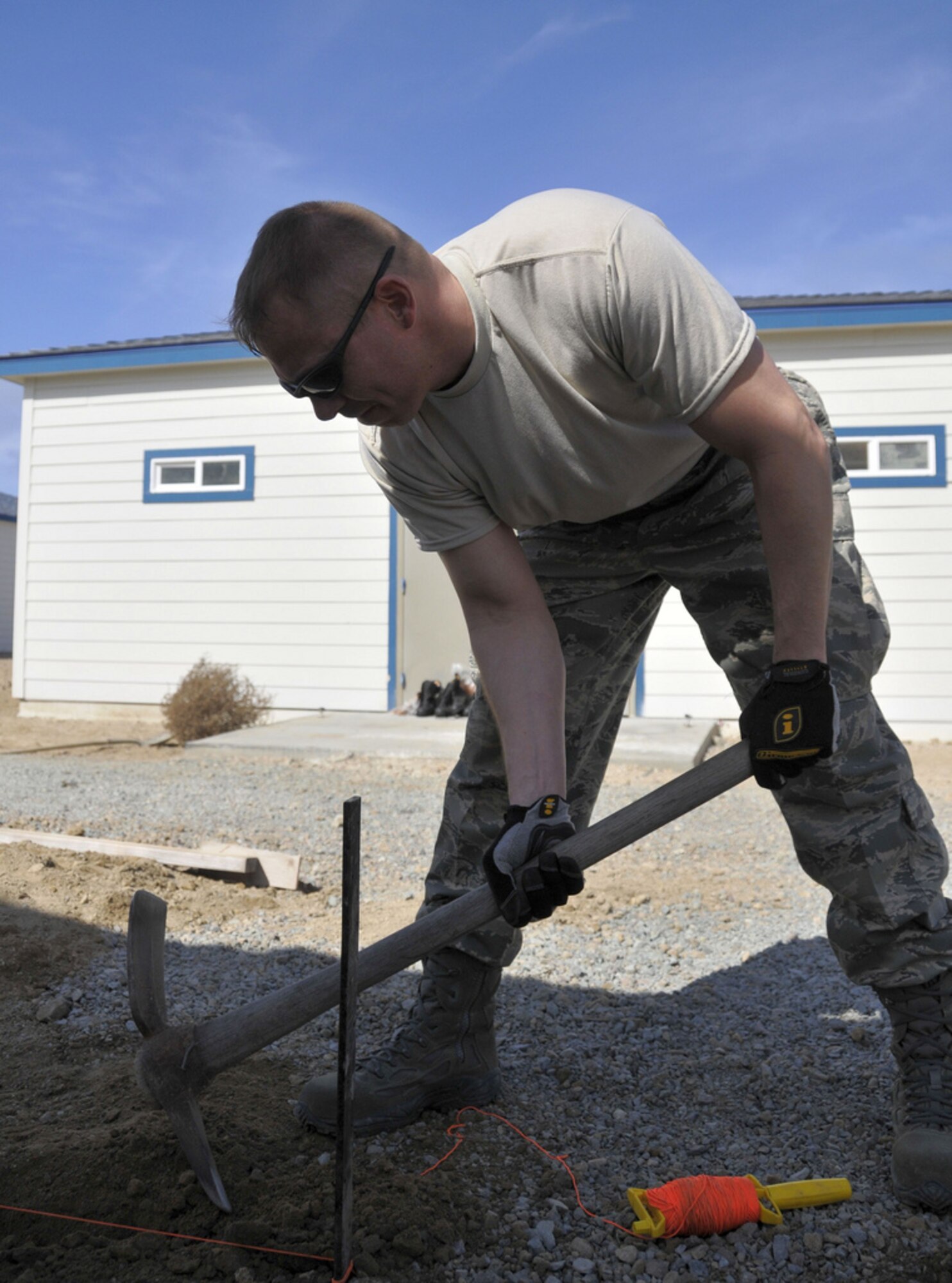 SAN CLEMENTE ISLAND, Calif. -- Tech. Sgt. Bryan S. Spake, an entomology specialist with the Alaska Air National Guard's 176th Civil Engineer Squadron (176 CES), prepares groundwork here March 12 for setting concrete forms.

A native of South Hill, Va., Spake deployed to this remote location off the coast of southern California for training with his Air National Guard unit. The 176 CES, part of the Alaska Air National Guard's 176th Wing, deployed to San Clemente Island for two weeks in March 2011 to train and work on a variety of infrastructure projects.

Alaska Air National Guard photo by Staff Sgt. N. Alicia Goldberger.