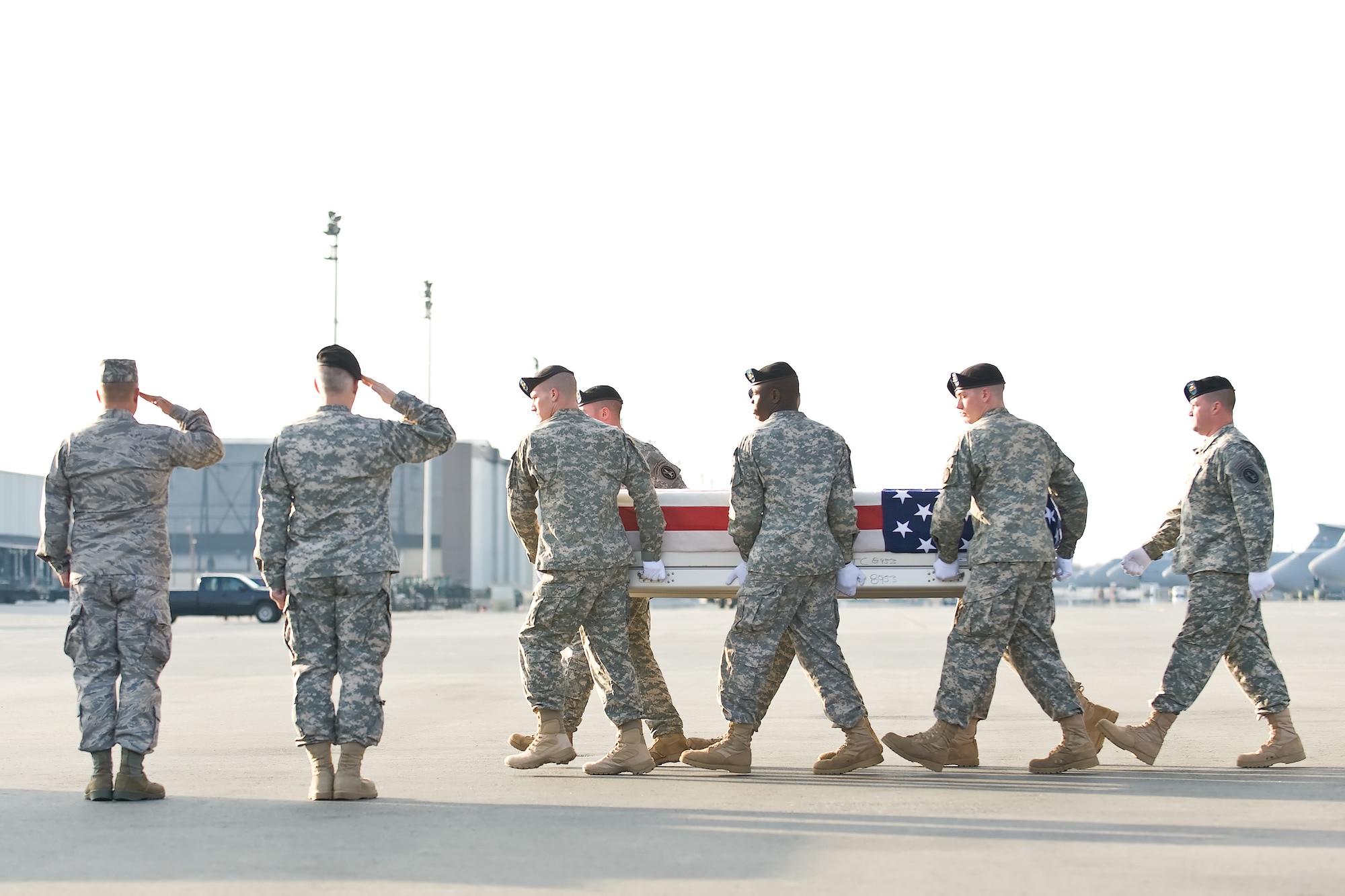 A U.S. Army carry team transfers the remains of Army Sgt. 1st Class Daehan Park, of Watertown, Conn., at Dover Air Force Base, Del., March 14, 2011. Park was assigned to the 3rd Battalion, 1st Special Forces Group, Joint Base Lewis-McChord, Wash. (U.S. Air Force photo/Roland Balik)