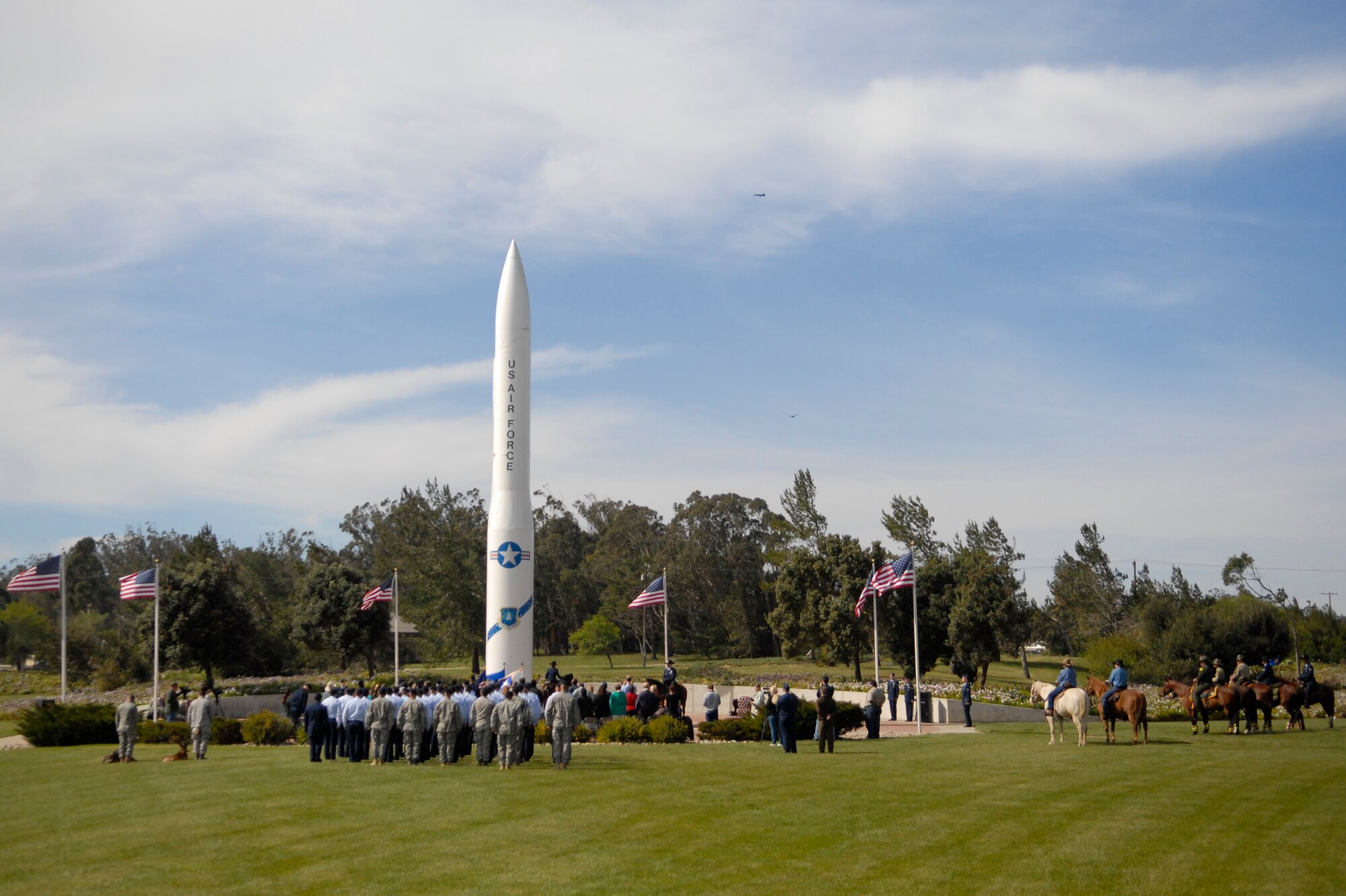 Willy and Judge, of the 30th Security Forces working horse unit, are retired by Lt. Col. Michelle Stringer, the 30th SFS commander, during a ceremony at Missile V here Monday, March 14, 2011.  (U.S. Air Force photo/1st. Lt. Ann Blodzinski)