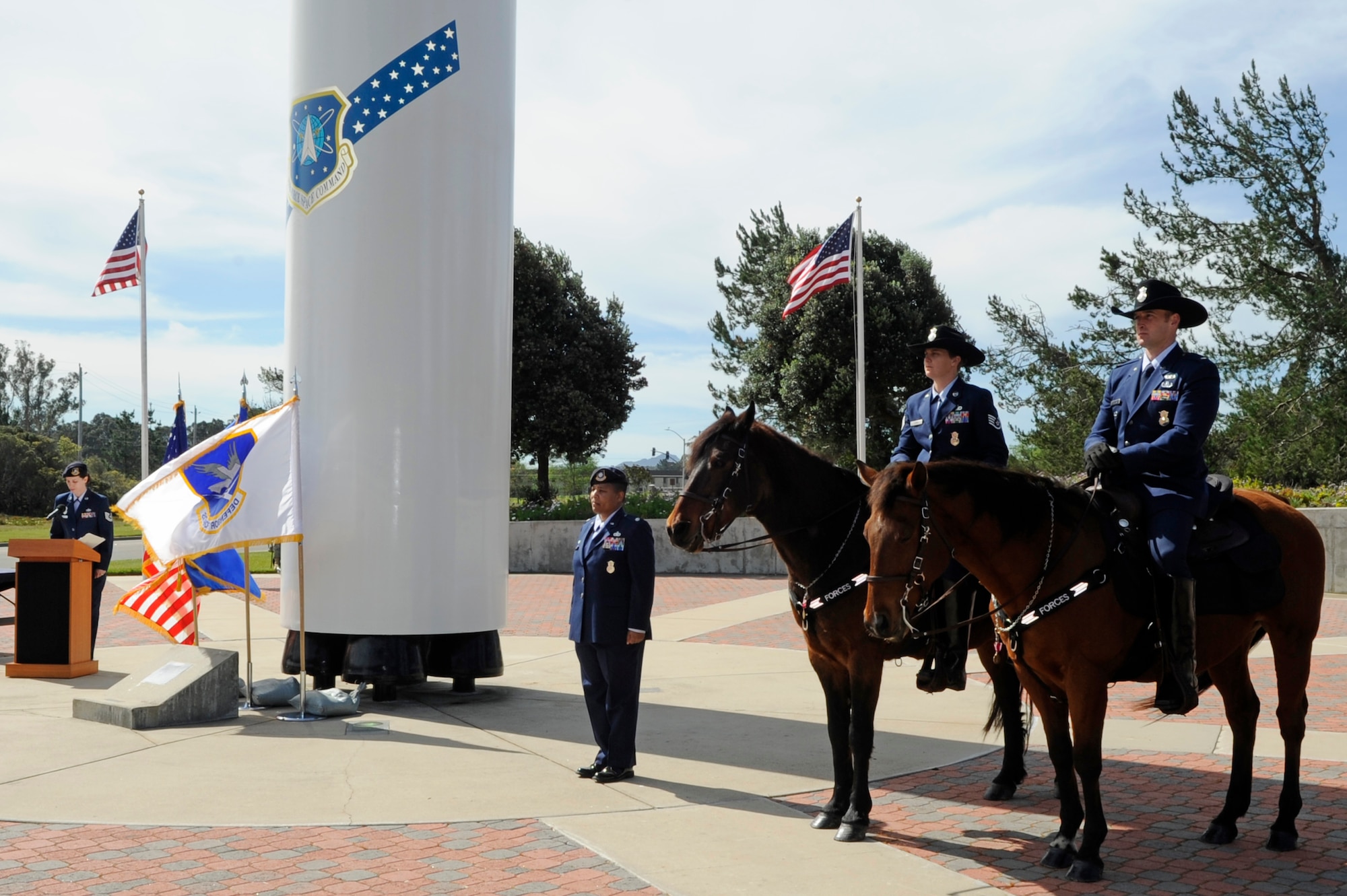 Willy and Judge, of the 30th Security Forces working horse unit, are retired by Lt. Col. Michelle Stringer, the 30th SFS commander, during a ceremony at Missile V here Monday, March 14, 2011. (U.S. Air Force photo/Senior Airman Lael Huss)