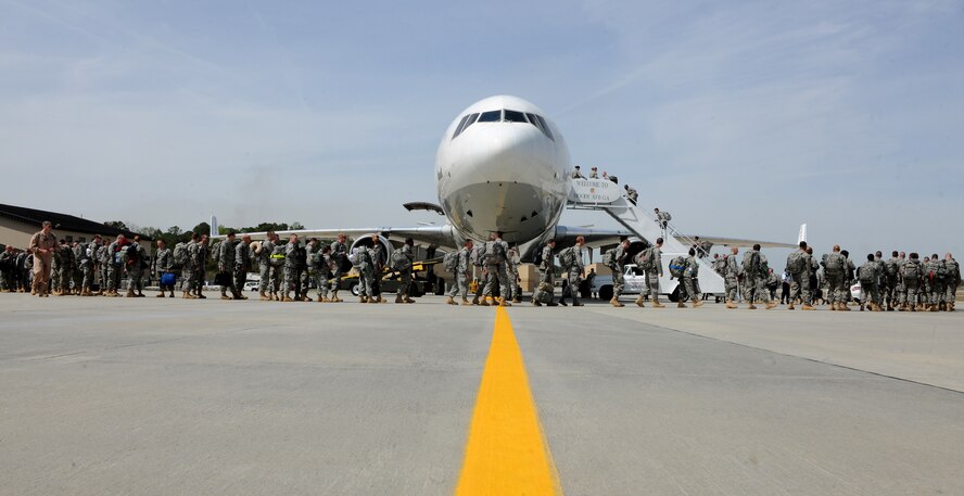 MOODY AIR FORCE BASE, Ga.-- Nearly 300 members of the 23rd Maintenance Group load a commercial aircraft as they leave for a six month deployment to Afghanistan March 14. The aircraft will make several stops before landing in Afghanistan. (U.S. Air Force photo/Airman 1st Class Benjamin Wiseman)(RELEASED)