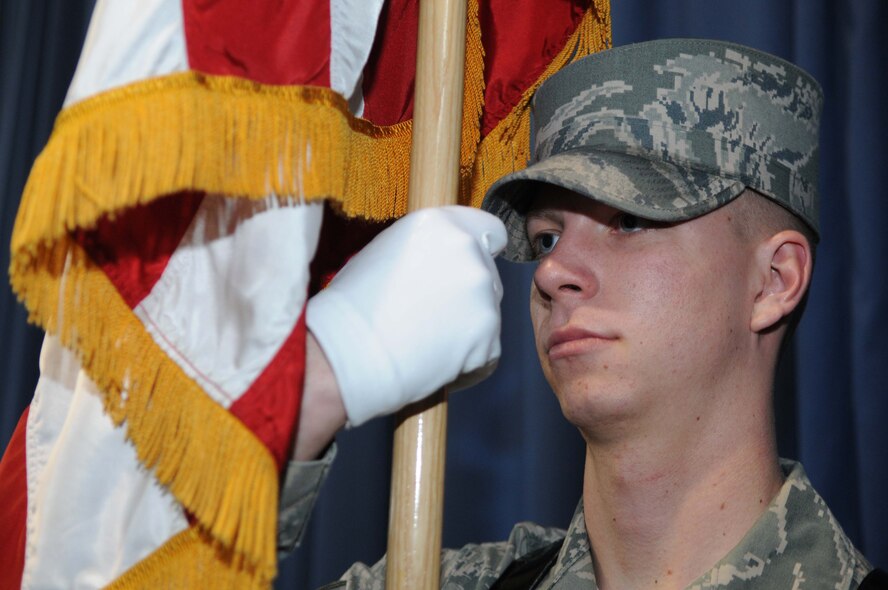 Airman 1st Class Charles Black, Ceremonial guardsman in The U.S. Air Force Honor Guard, stands in the right shoulder position holding the U.S. flag, March 11, Joint Base Anacostia-Bolling, Washington, D.C. Five USAF Honor Guard members were selected for their dedication and volunteer spirit from the National Capital Wing of the Civil Air Patrol to be recognized for their service at an annual awards banquet held March 12, 2011 at Joint Base Ancostia-Bolling.  (U.S. Air Force Photo by Senior Airman Christopher Ruano)