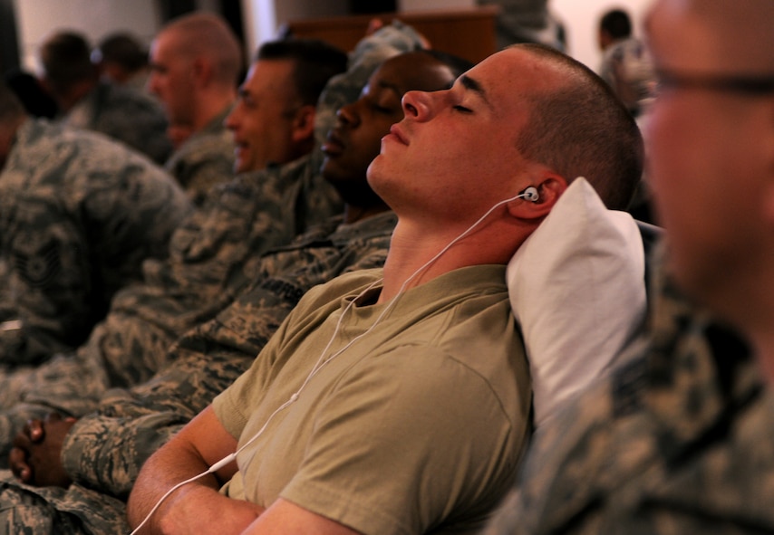 MOODY AIR FORCE BASE, Ga.-- Senior Airman Talmadge Borthwick, 23rd Equipment Maintenance Squadron aircraft structural maintenance, takes a nap while waiting to depart on a deployment March 14. Members of the 23rd Maintenance Group played cards, napped and watched movies to pass time until the aircraft arrived to take them to Afghanistan. (U.S. Air Force photo/Airman 1st Class Benjamin Wiseman)(RELEASED)