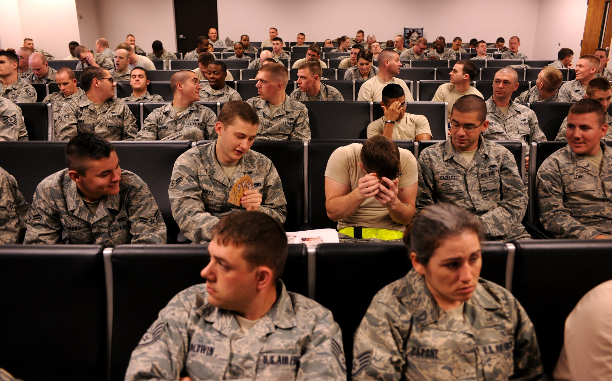 MOODY AIR FORCE BASE, Ga.-- Nearly 300 members of the 23rd Maintenance Group sit inside the deployment control center March 14. Members of the 23rd MXG waited in the DCC before departing on their six month deployment to Afghanistan. (U.S. Air Force photo/Airman 1st Class Benjamin Wiseman)(RELEASED)