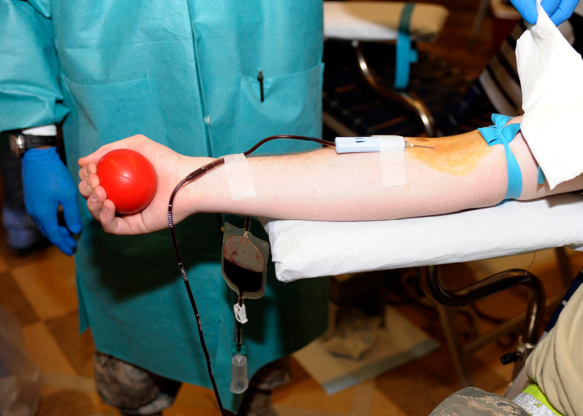 Blood flows from a donor's arm during a blood drive at the base chapel at Cannon Air Force Base, N.M., March 14, 2011. Dozens of Air Commandos gave blood during a two-day drive. (U.S. Air Force photo by Airman Ericka Engblom) 

