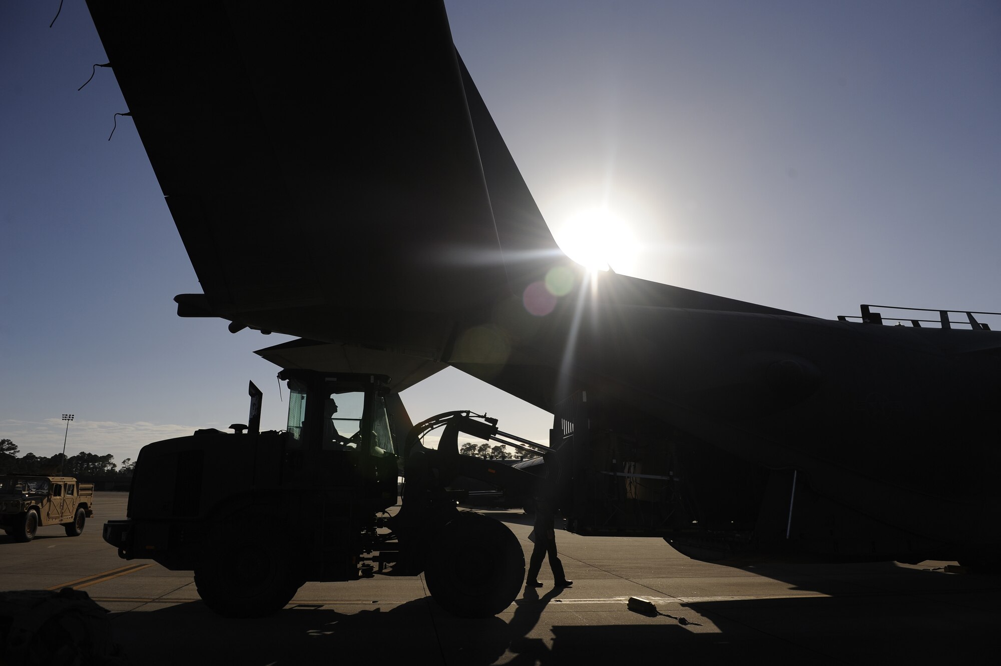 A U.S. Air Force MC-130H Combat Talon II aircraft loadmaster assigned to the 15th Special Operations Squadron guides a forklift loading an aircraft March 3, 2011, at Hurlburt Field, Fla., in support of Emerald Warrior 2011. Emerald Warrior is an annual two-week joint/combined tactical exercise sponsored by U.S. Special Operations Command to provide realistic training opportunities to conventional and special operations forces. (U.S. Air Force photo by Tech. Sgt. Manuel J. Martinez/Released)