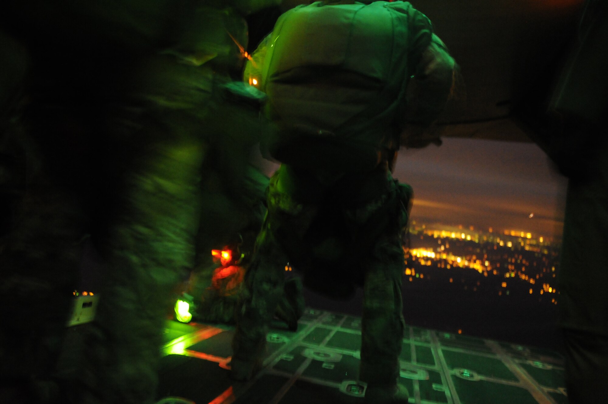 U.S. Air Force Staff Sgt. Dave Holcombe, an MC-130P Combat Shadow aircraft loadmaster assigned to the 9th Special Operations Squadron, waits to open the ramp doors for combat weatherman jumpers assigned to the 10th Combat Weather Squadron in the skies over Florida March 2, 2011, in support of Emerald Warrior 2011. Emerald Warrior is a U.S. Special Operations Command-sponsored, multiservice exercise designed to leverage lessons learned from overseas operations. (U.S. Air Force photo by Tech. Sgt. Manuel J. Martinez/Released)
