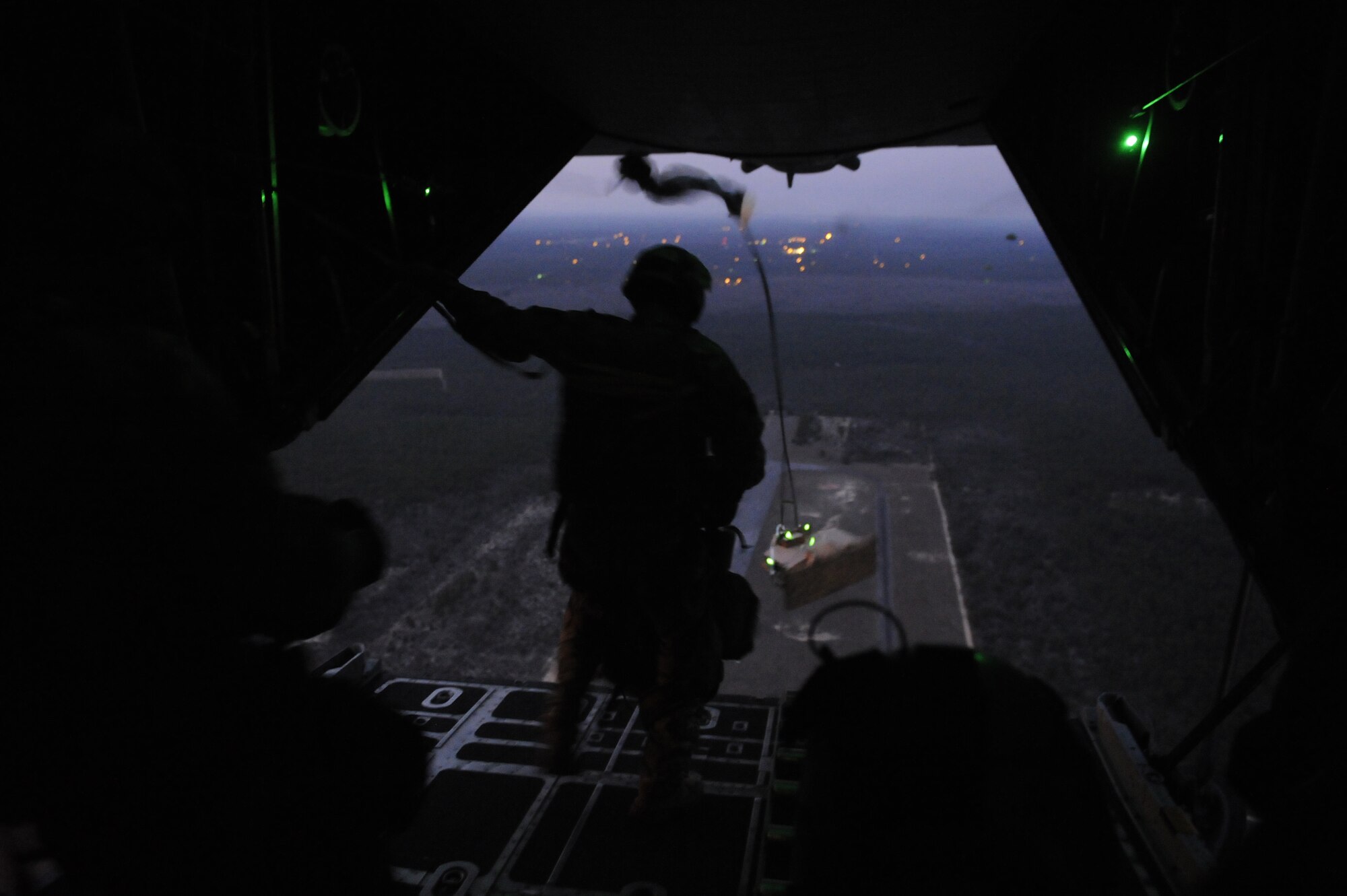U.S. Air Force combat control students prepare to jump off the ramp of an MC-130P Combat Shadow aircraft during an airfield seizure training mission over Florida March 2, 2011, in support of Emerald Warrior 2011. Emerald Warrior is a U.S. Special Operations Command-sponsored, multiservice exercise designed to leverage lessons learned from overseas operations. (U.S. Air Force photo by Tech. Sgt. Manuel J. Martinez/Released)