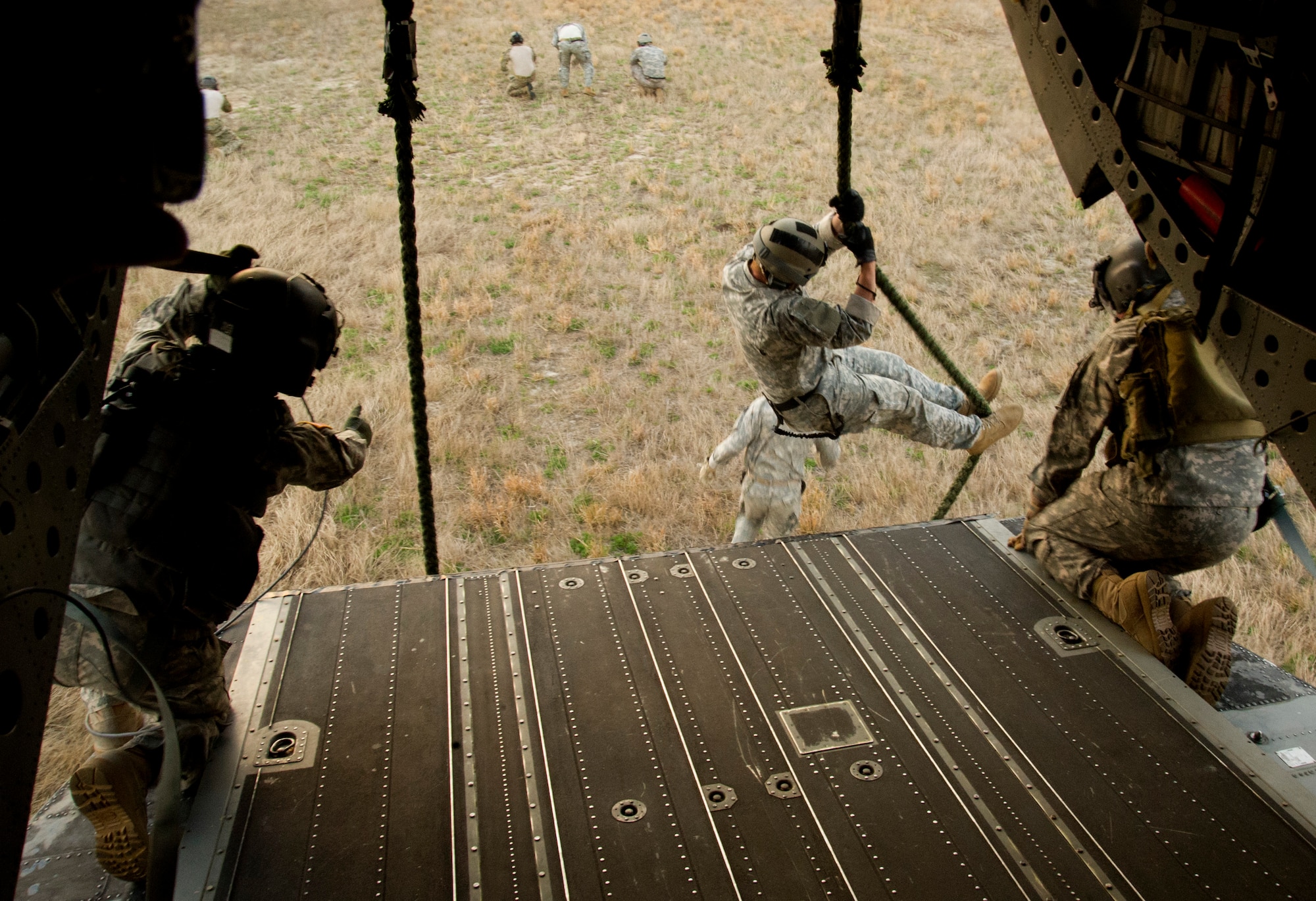 A U.S. Soldier assigned to the 4th Battalion, 10th Special Forces Group fast ropes out of a helicopter during Emerald Warrior 2011 in Tallahassee, Fla., March 2, 2011. Emerald Warrior is an annual two-week joint/combined tactical exercise sponsored by U.S. Special Operations Command to provide realistic training opportunities to conventional and special operations forces. (U.S. Air Force photo by Tech. Sgt. Bradley C. Church/Released)