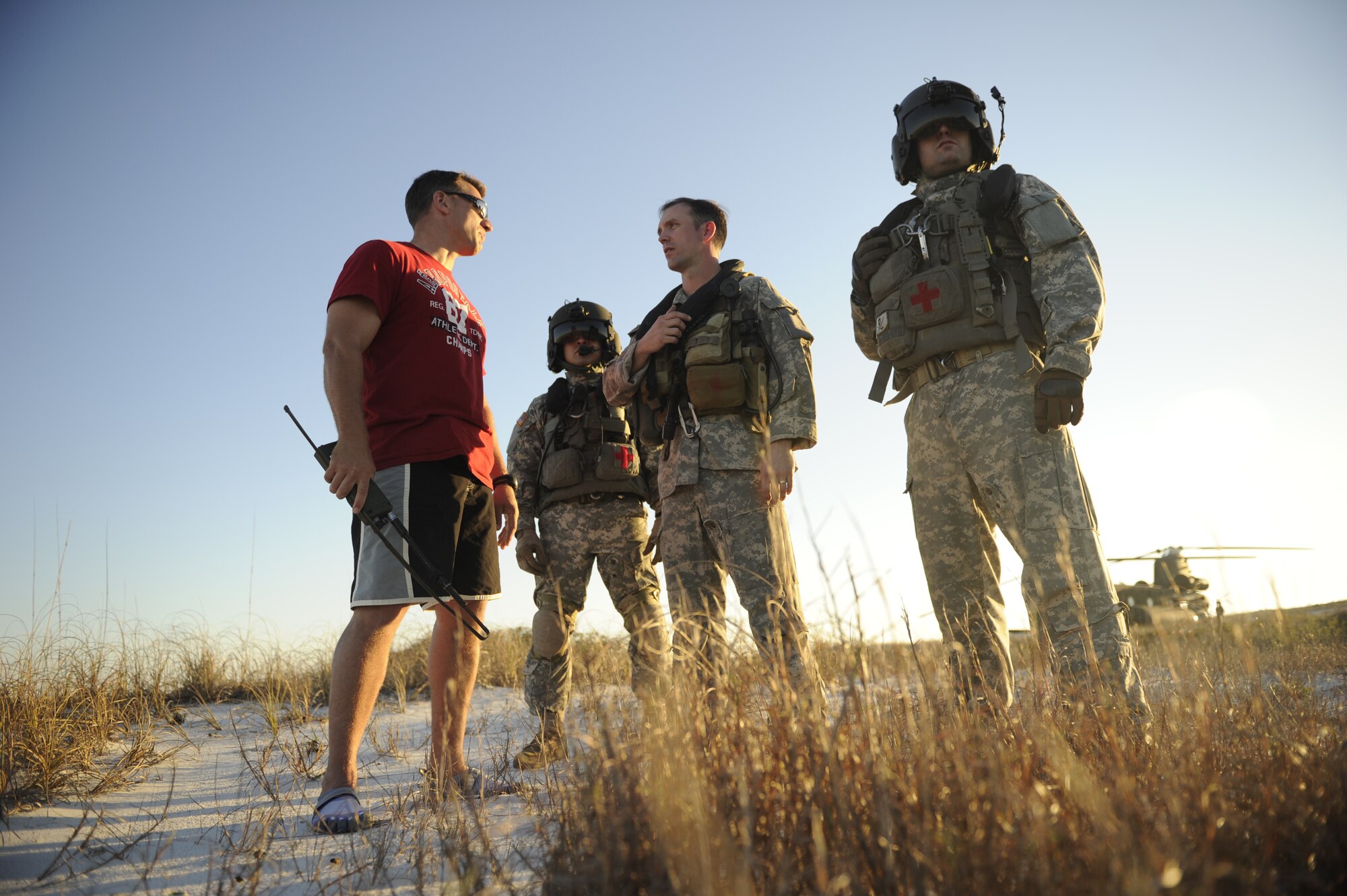 U.S. Soldiers assigned to the 160th Special Operations Aviation Regiment discuss plans for a water training mission with members of the 10th Special Forces Group March 1, 2011, at Fort Walton Beach, Fla., during Emerald Warrior 2011. Emerald Warrior is a U.S. Special Operations Command-sponsored, multiservice exercise designed to leverage lessons learned from overseas operations. (U.S. Air Force photo by Tech. Sgt. Manuel J. Martinez/Released)