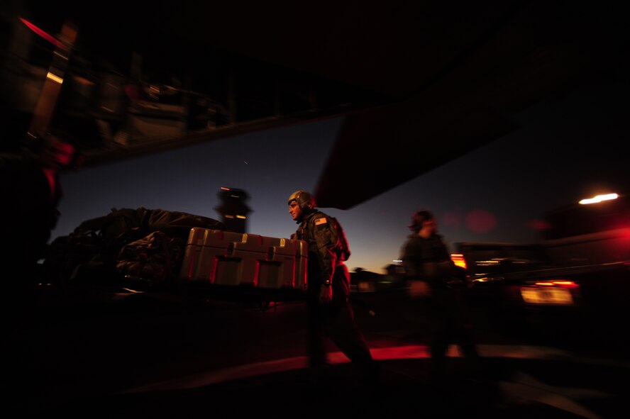 U.S. Air Force Master Sgt. Rafael Garcia, an Independent Duty Medical Tech (IDMT) assigned to the 1st Special Operations Support Squadron, Hurlburt Field Fla., carries  a litter with medical equipment aboard a MC-130H Combat Talon II aircraft during Emerald Warrior on March 1, 2011. Emerald Warrior 2011 is a U.S. Special Operations Command-sponsored, multiservice exercise designed to leverage lessons learned from Operations Iraqi Freedom and Enduring Freedom to provide trained and ready forces to combatant commanders.(USAF photo by SSgt Andy M. Kin)(Released)